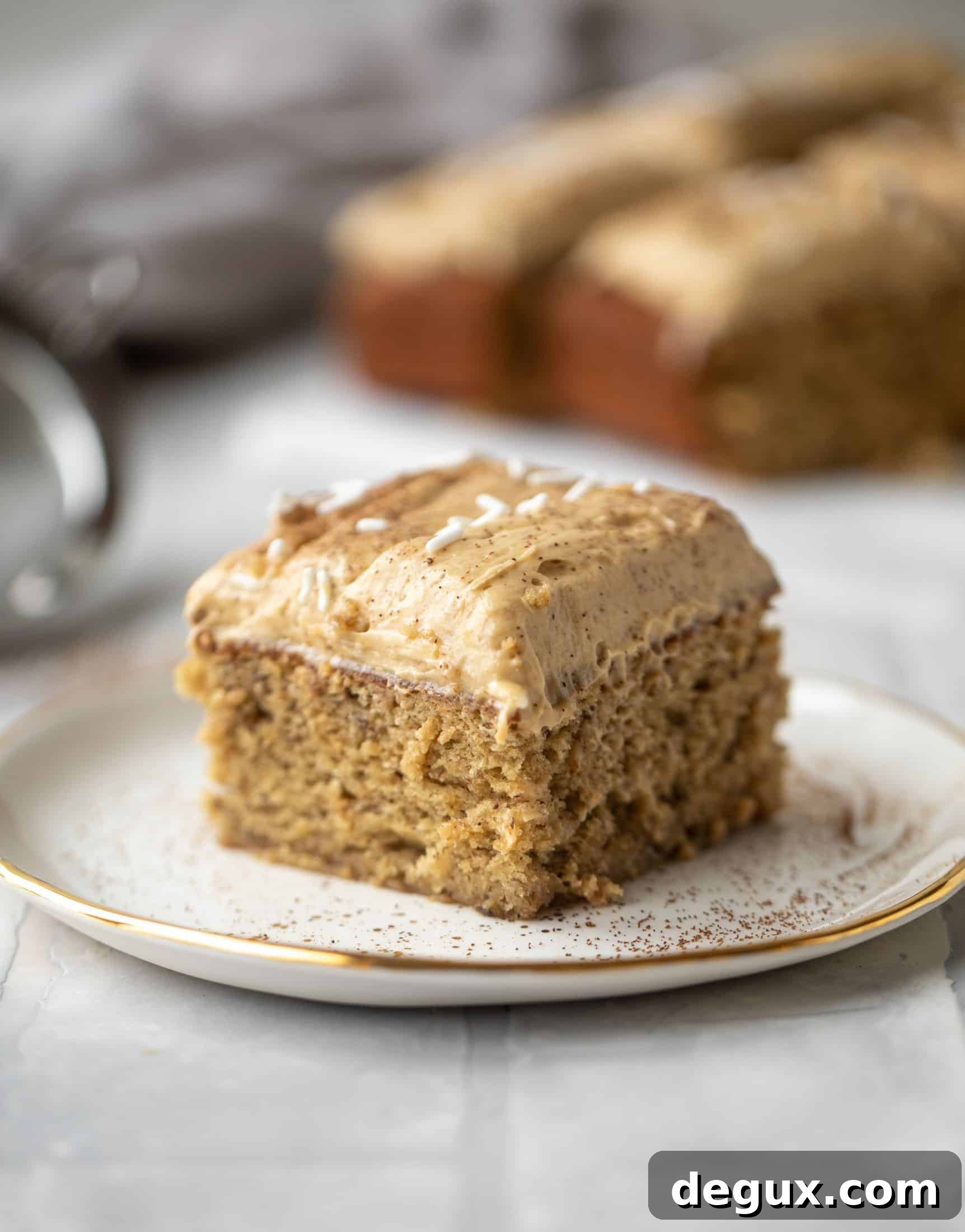 This banana cake is a delicious twist on banana bread! Covered with coffee cream cheese frosting, it’s an easy and wonderful treat.