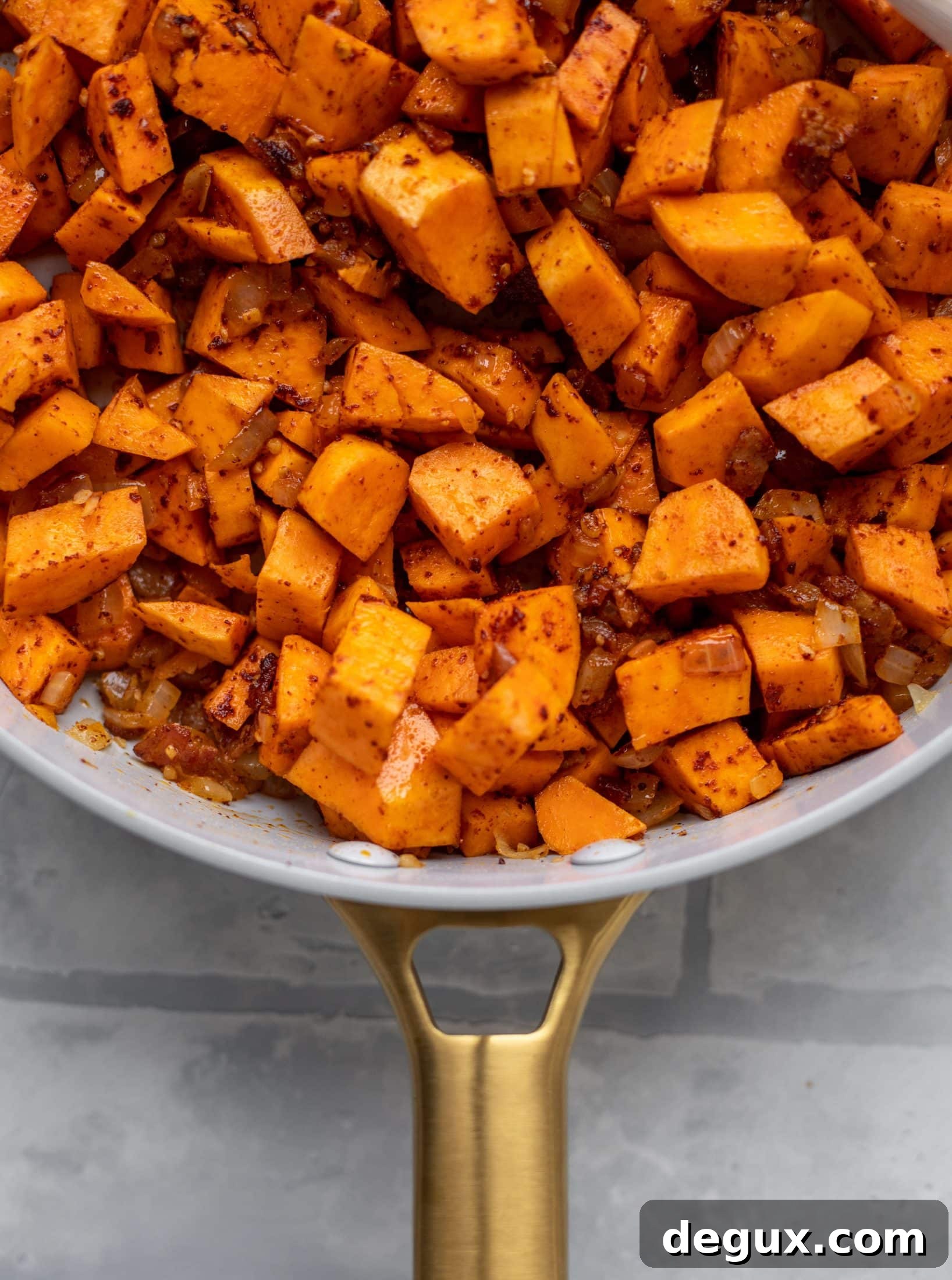 This chipotle sweet potato hash is perfect for breakfast, lunch or dinner. Bulked up with quinoa and tons of flavor, it's a great pantry weeknight meal!