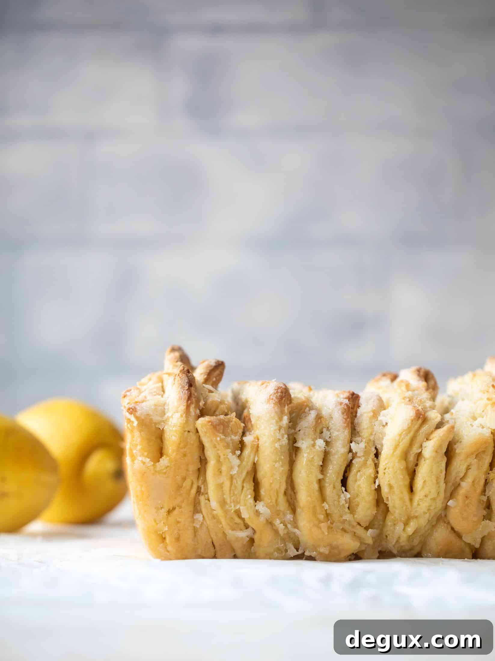 Lemon Coconut Pull-Apart Bread Recipe for Brunch 2 This lemon coconut bread is a pull apart dream! It's perfect for brunch or dessert with the perfect amount of fluffiness.