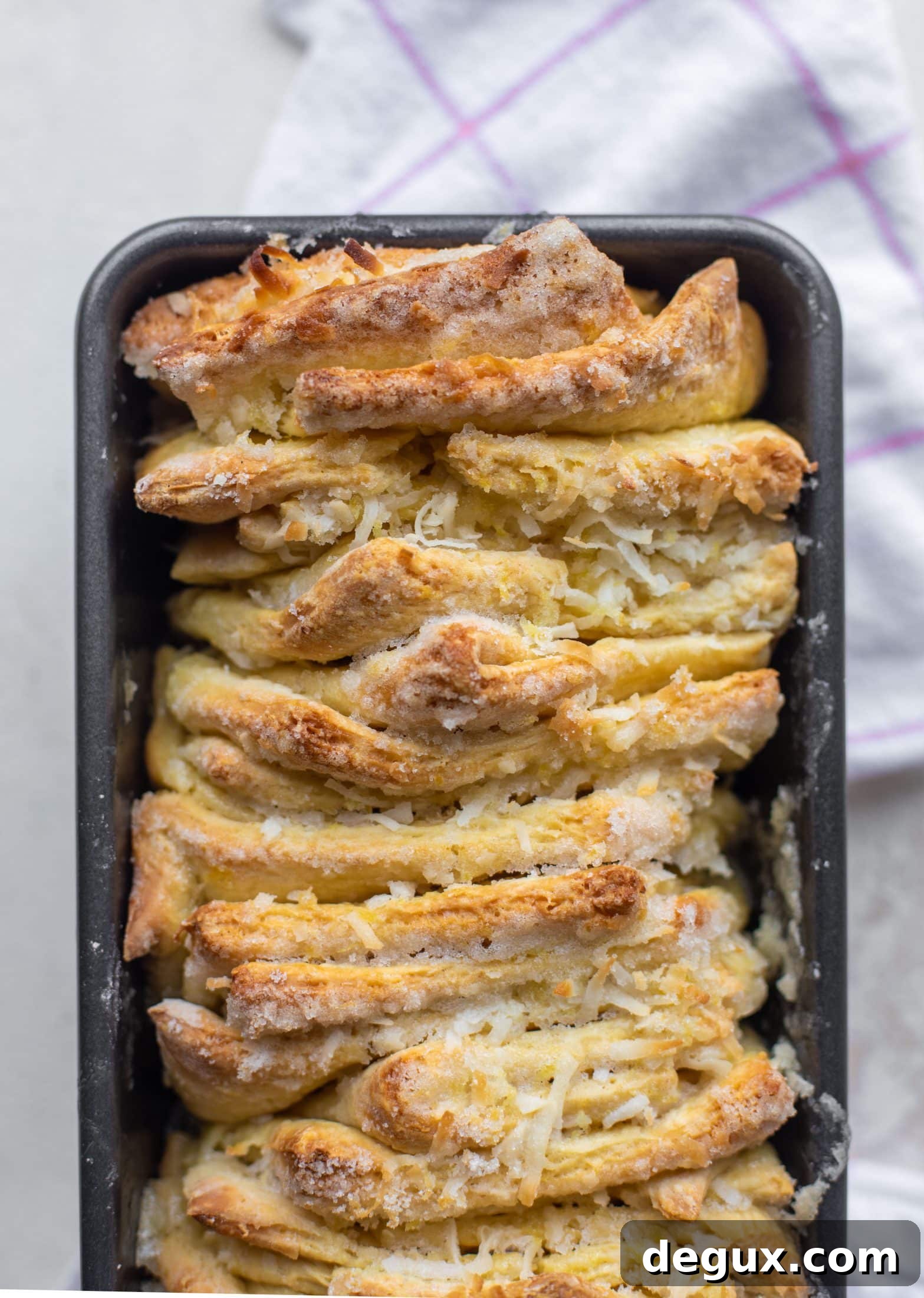 Lemon Coconut Pull-Apart Bread Recipe for Brunch 7 This lemon coconut bread is a pull apart dream! It's perfect for brunch or dessert with the perfect amount of fluffiness.