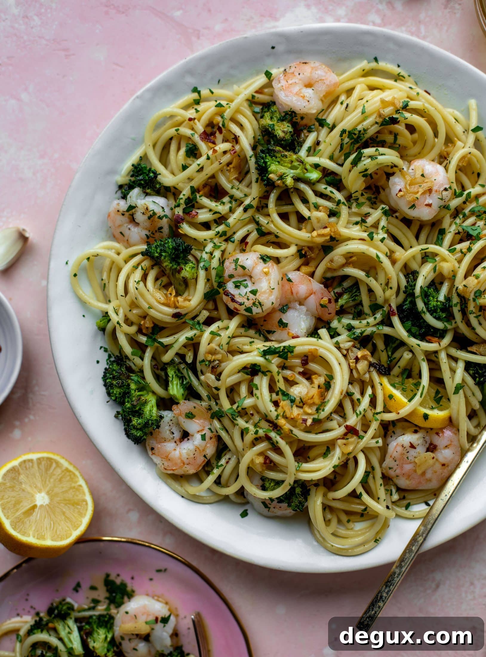 This garlic sauce pasta is incredible! Roasted shrimp and broccoli twirled with garlic oil noodles and crushed red pepper. Divine!