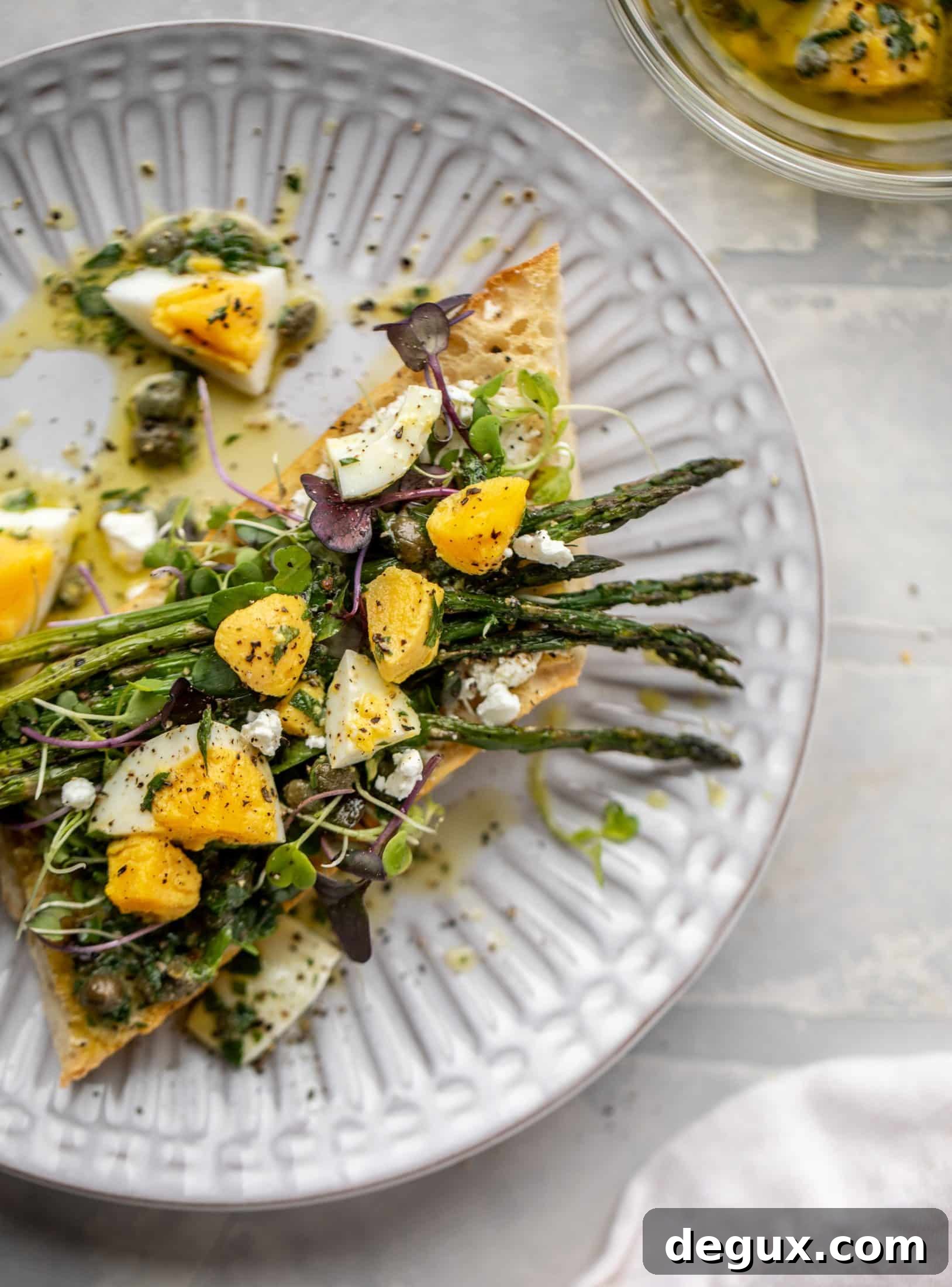 This hard boiled egg vinaigrette is a great way to use up leftover hard boiled eggs! It's fabulous on roasted vegetables, salads and toast.