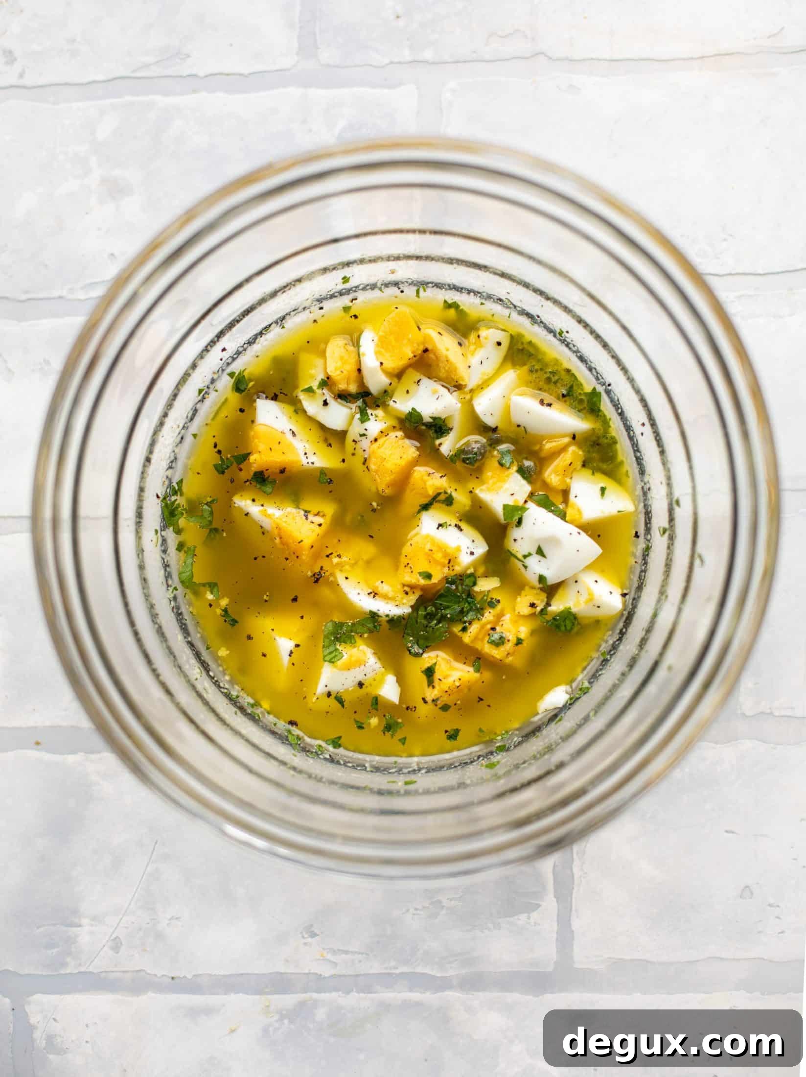 This hard boiled egg vinaigrette is a great way to use up leftover hard boiled eggs! It's fabulous on roasted vegetables, salads and toast.