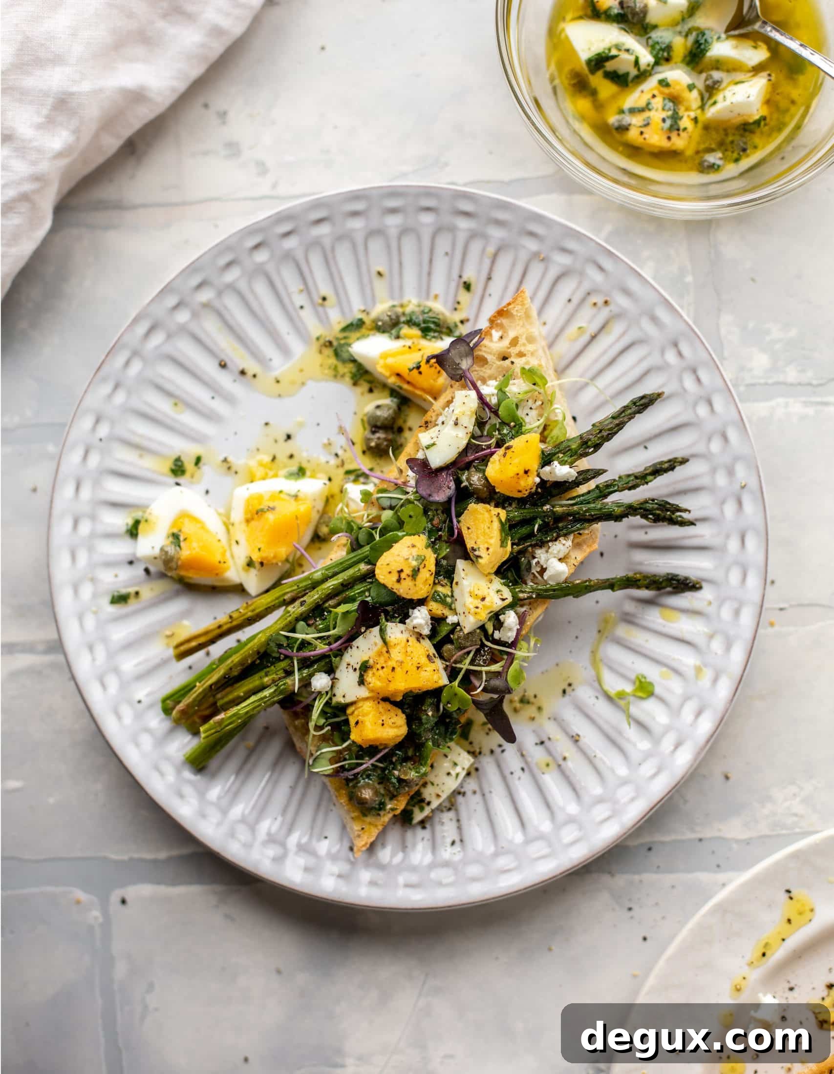 This hard boiled egg vinaigrette is a great way to use up leftover hard boiled eggs! It's fabulous on roasted vegetables, salads and toast.