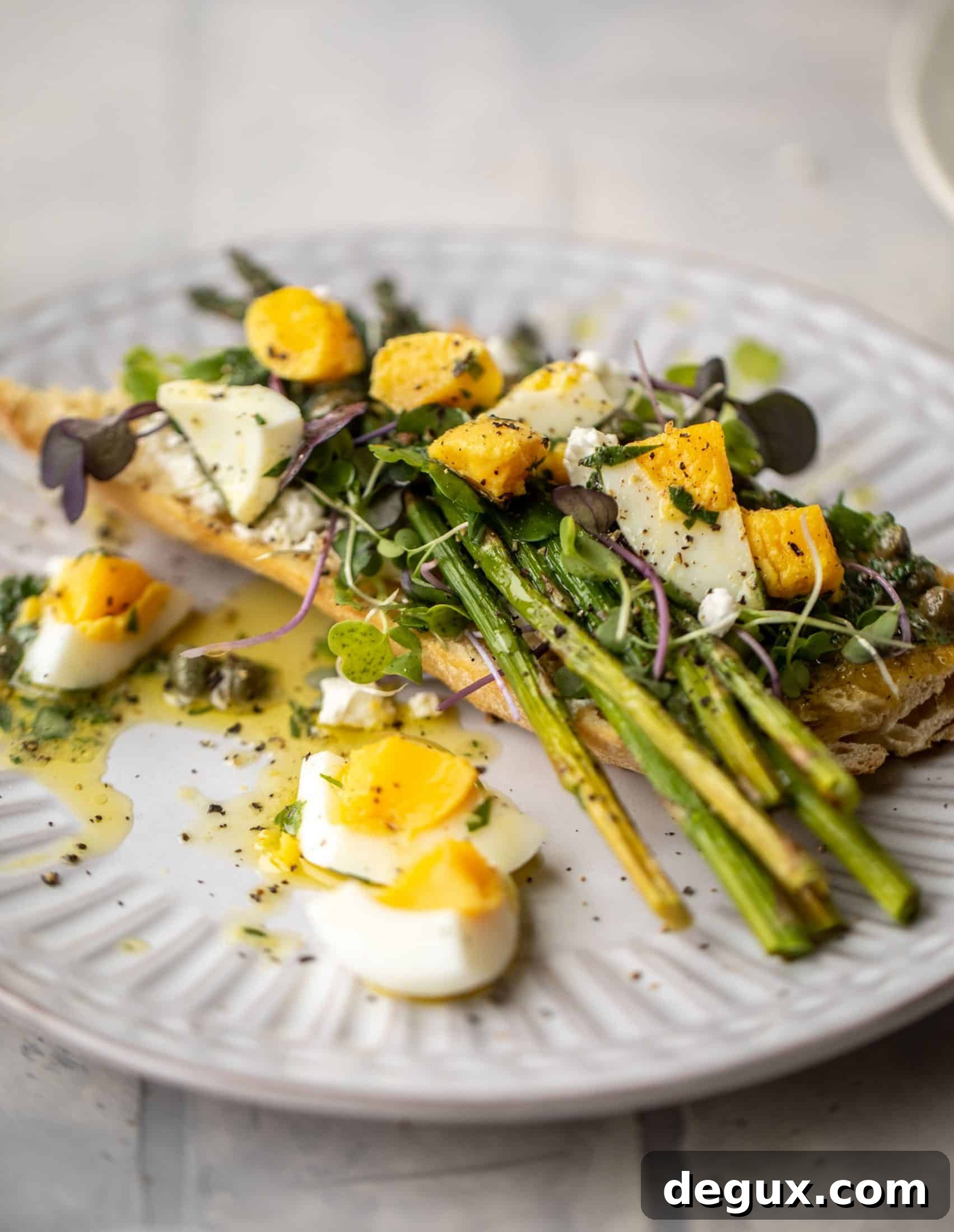 This hard boiled egg vinaigrette is a great way to use up leftover hard boiled eggs! It's fabulous on roasted vegetables, salads and toast.