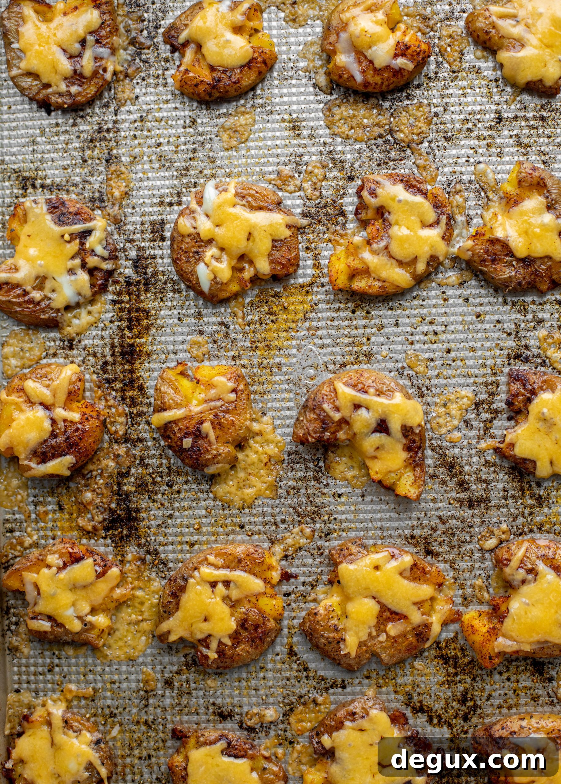 smashed chipotle cheddar potatoes on baking sheet