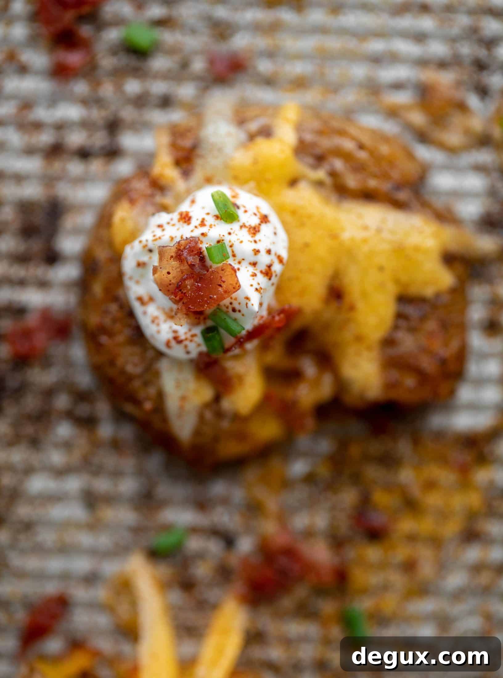 sour cream and bacon on chipotle cheddar smashed potatoes