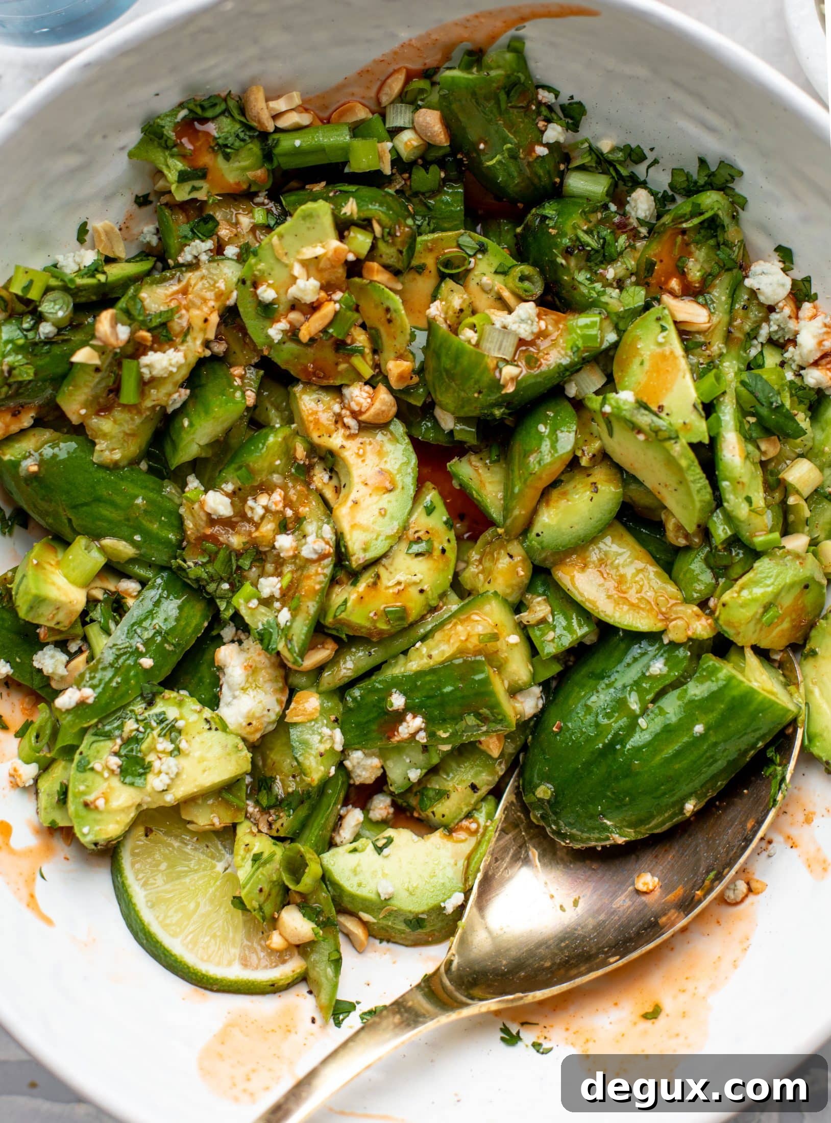 This smashed buffalo cucumber salad is filled with tons of buffalo wing flavor! Avocado, blue cheese, peanuts and lime juice make this irresistible. 