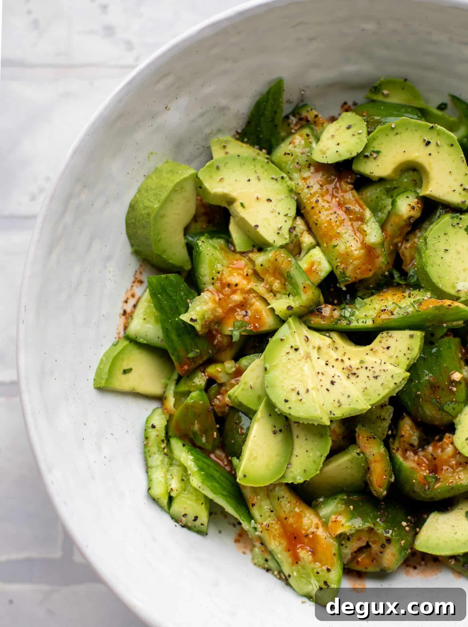 This smashed buffalo cucumber salad is filled with tons of buffalo wing flavor! Avocado, blue cheese, peanuts and lime juice make this irresistible. 
