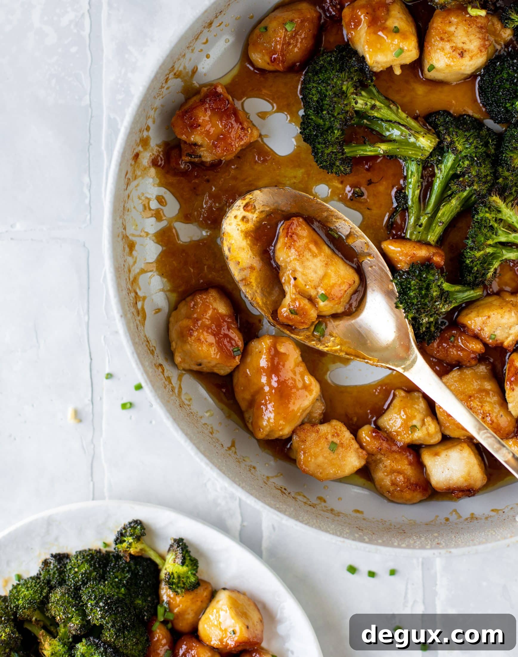 This sticky apricot chicken is so juicy and delicious! The chicken is seared and glazed with a jammy apricot sauce. Serve with broccoli and rice!