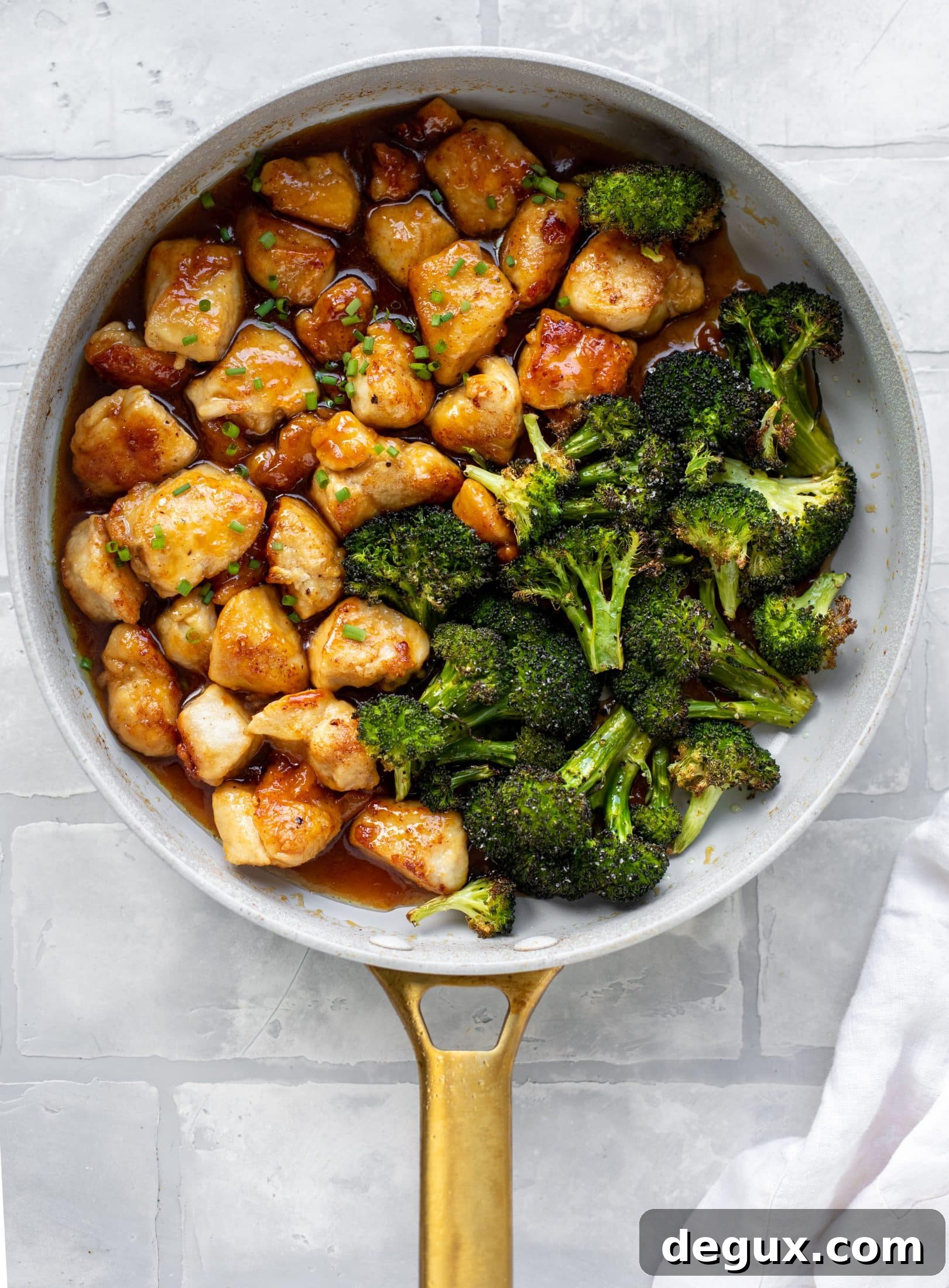 This sticky apricot chicken is so juicy and delicious! The chicken is seared and glazed with a jammy apricot sauce. Serve with broccoli and rice!