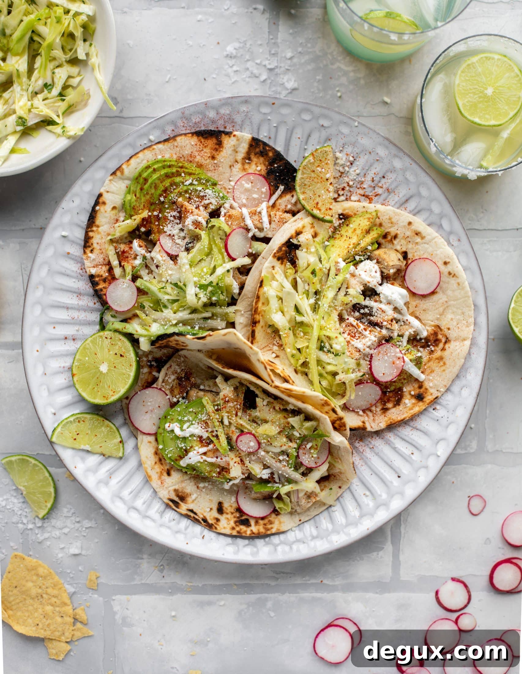 These grilled chicken tacos are easy and flavorful. They are super smoky, then topped with a key lime slaw that is absolutely delicious!