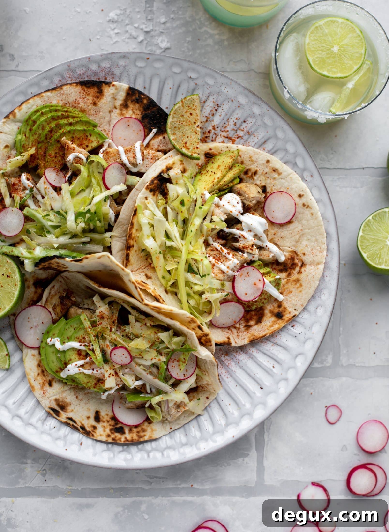 These grilled chicken tacos are easy and flavorful. They are super smoky, then topped with a key lime slaw that is absolutely delicious!