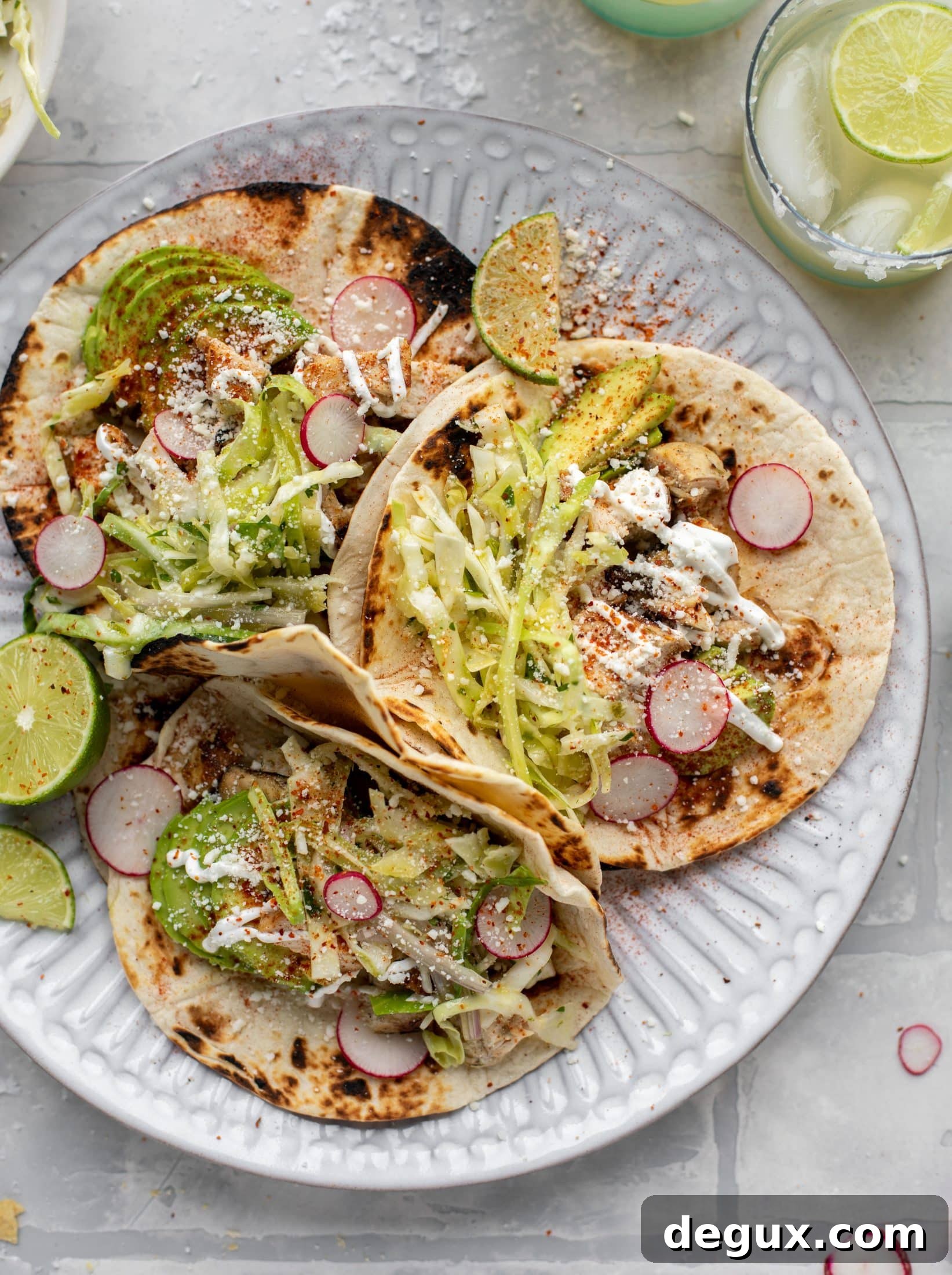 These grilled chicken tacos are easy and flavorful. They are super smoky, then topped with a key lime slaw that is absolutely delicious!