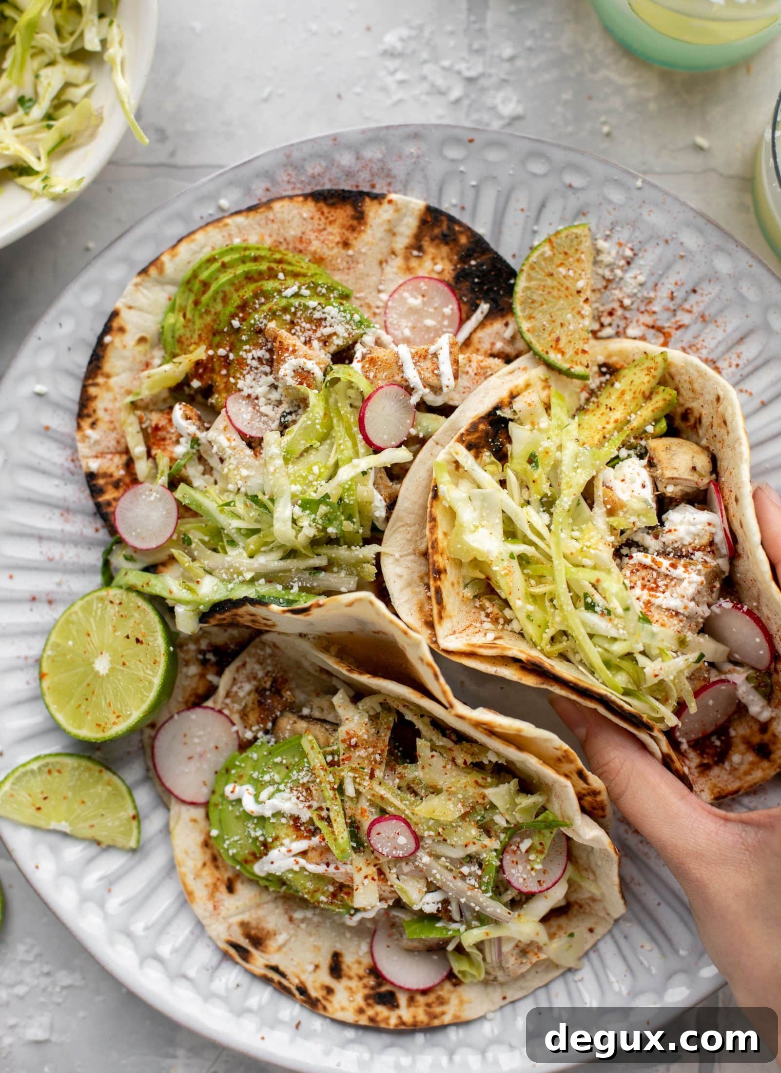 These grilled chicken tacos are easy and flavorful. They are super smoky, then topped with a key lime slaw that is absolutely delicious!