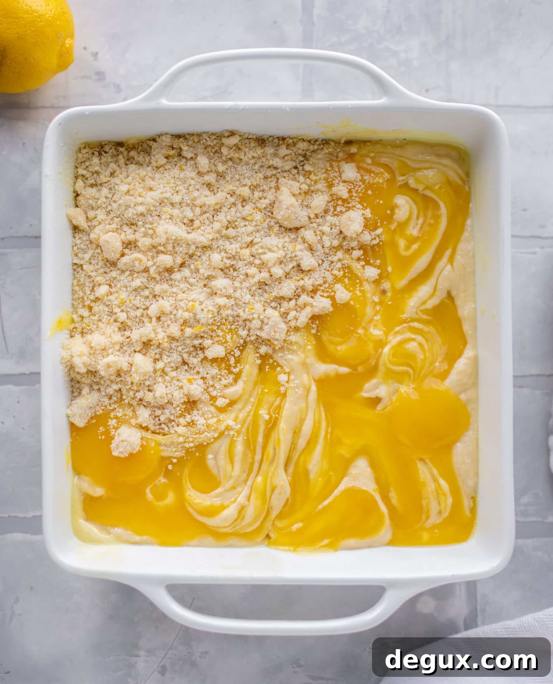 Moist Lemon Crumb Cake Recipe with Zesty Crumble Topping 6 sprinkling crumb on lemon crumb cake