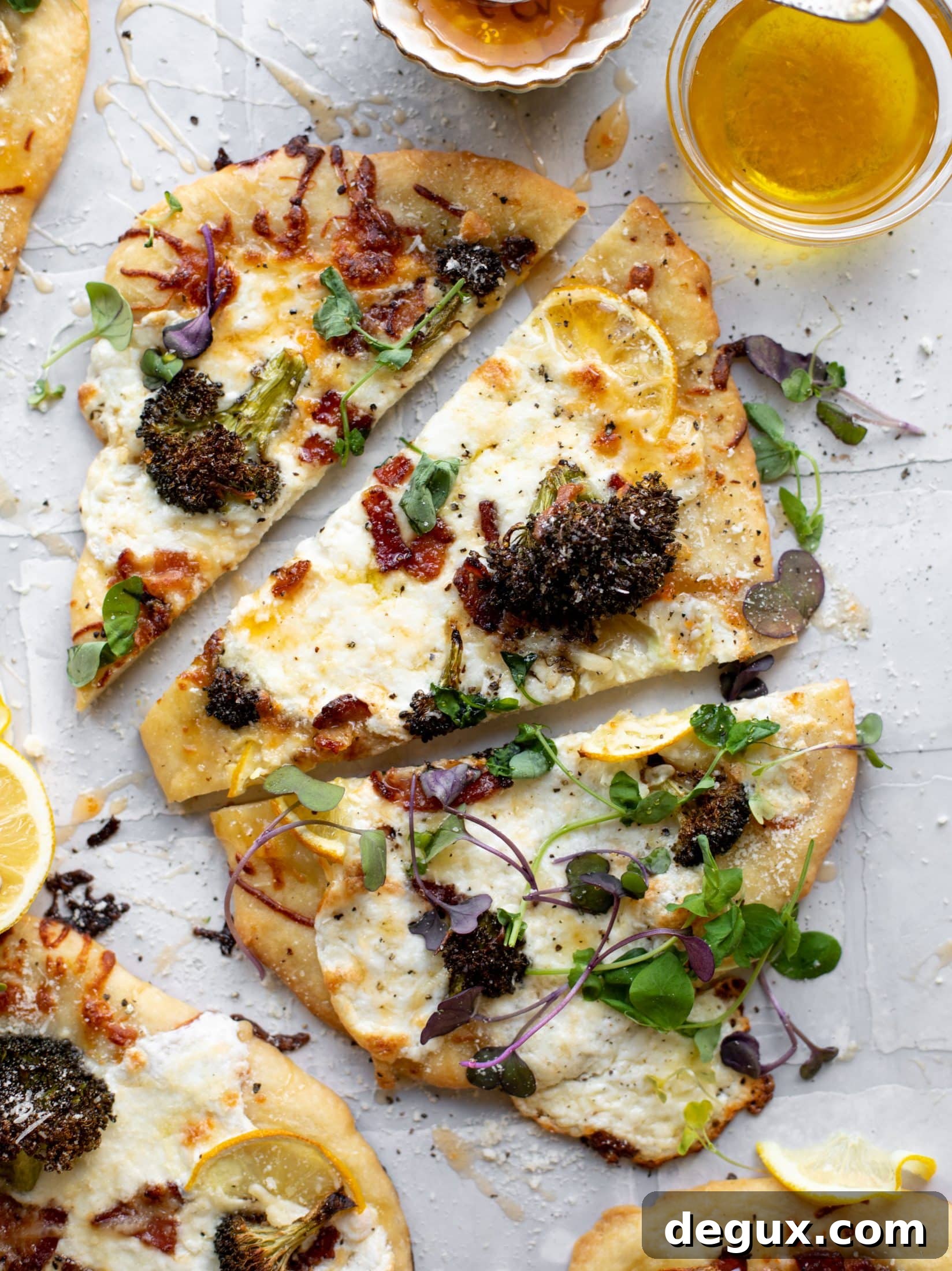 Cheesy Lemon Flatbread Pizza Drizzled with Spicy Honey 10 This cheesy lemon flatbread pizza is covered with burrata cheese, parmesan, roasted vegetables and hot honey. It's a flavor dream!