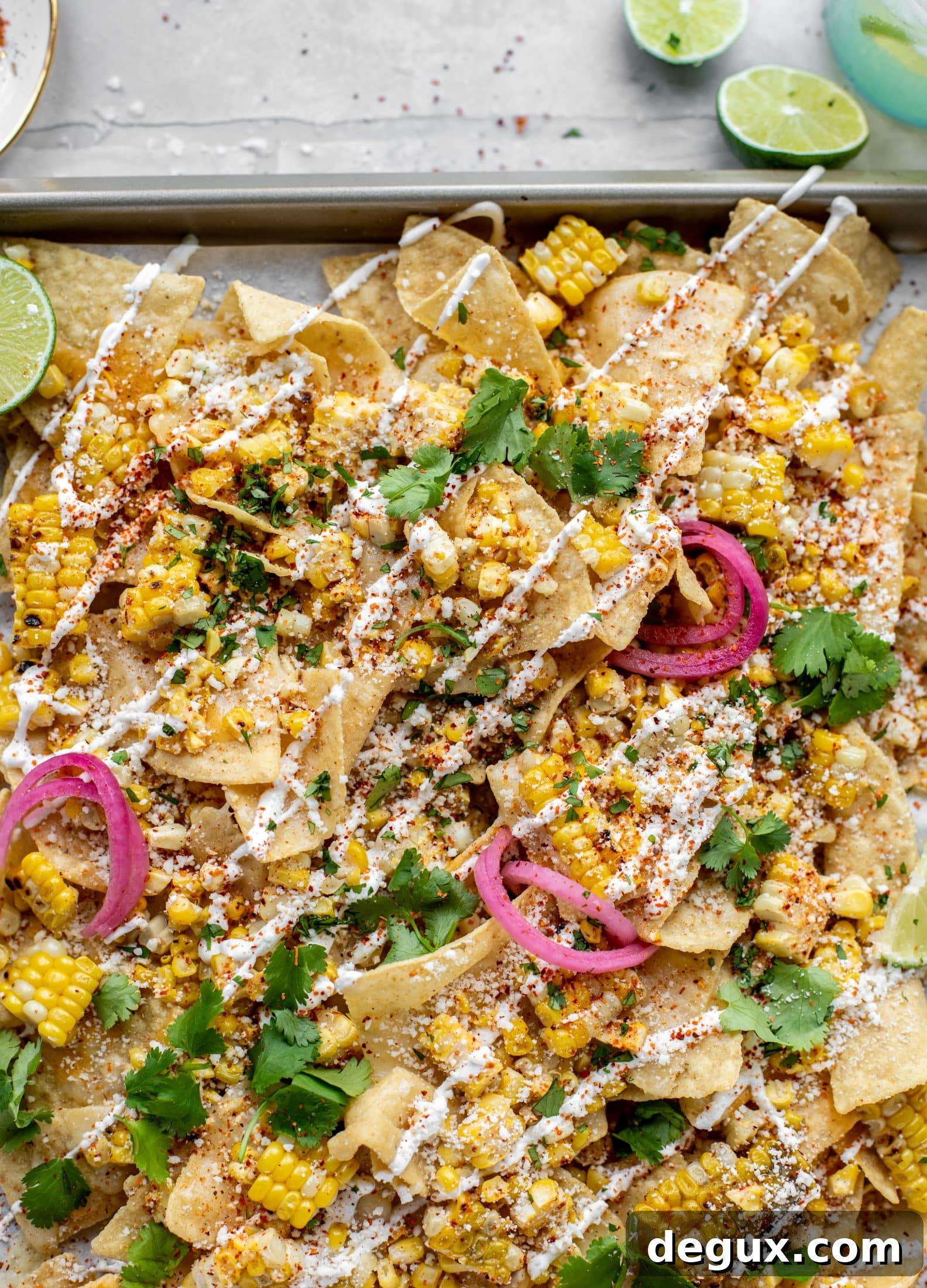 Sheet Pan Street Corn Nachos Recipe for Crowd-Friendly Snack 2 These sheet pan street corn nachos are ridiculously easy and delicious! Grilled corn, chili, lime, tons of cheese and all the flavor you could dream of!
