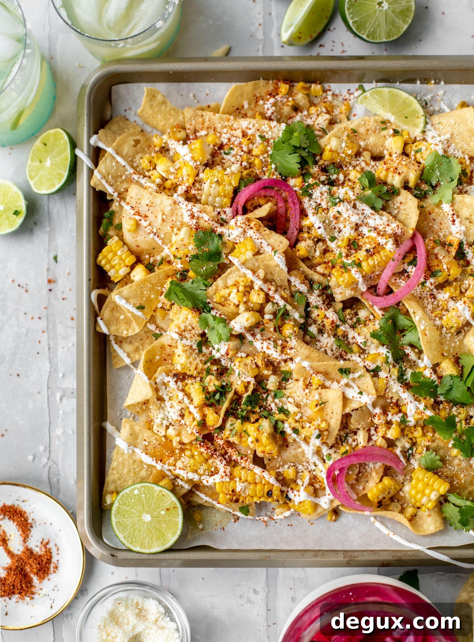Sheet Pan Street Corn Nachos Recipe for Crowd-Friendly Snack 11 These sheet pan street corn nachos are ridiculously easy and delicious! Grilled corn, chili, lime, tons of cheese and all the flavor you could dream of!