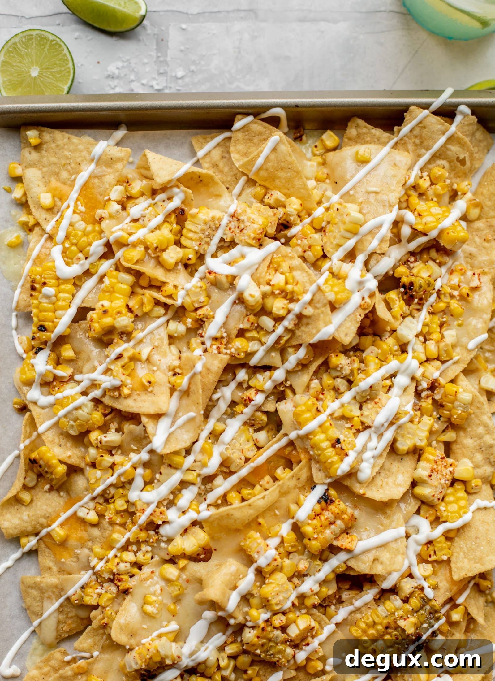 Sheet Pan Street Corn Nachos Recipe for Crowd-Friendly Snack 5 These sheet pan street corn nachos are ridiculously easy and delicious! Grilled corn, chili, lime, tons of cheese and all the flavor you could dream of!
