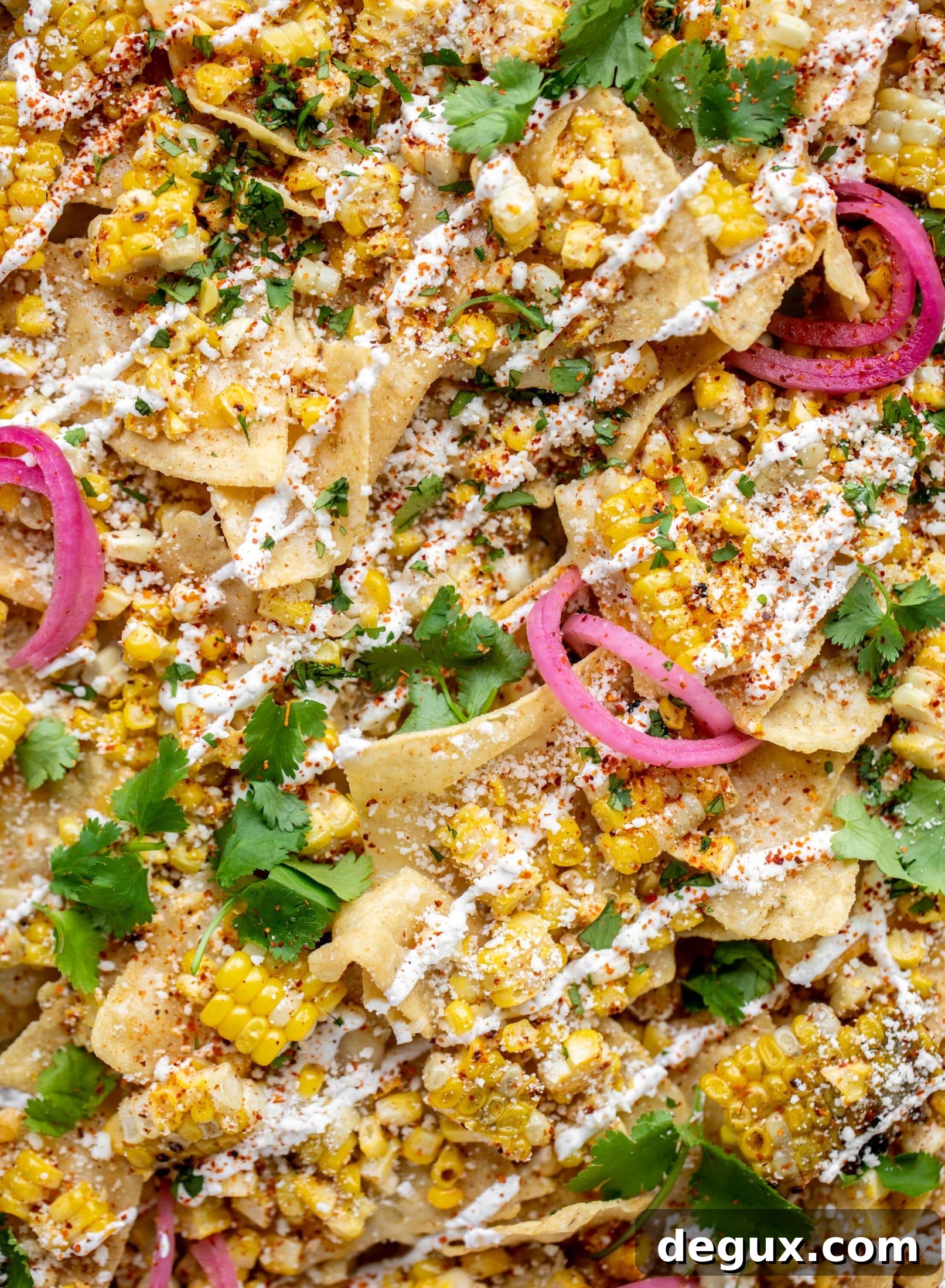 Sheet Pan Street Corn Nachos Recipe for Crowd-Friendly Snack 9 These sheet pan street corn nachos are ridiculously easy and delicious! Grilled corn, chili, lime, tons of cheese and all the flavor you could dream of!