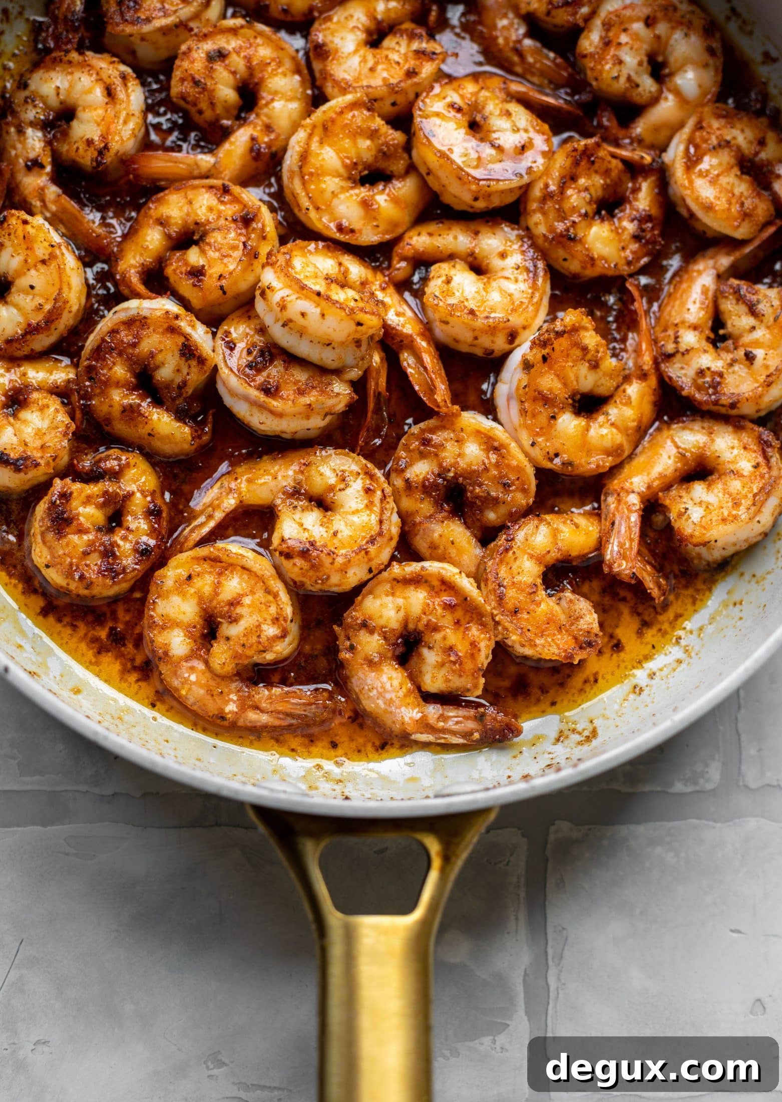 Cajun Honey-Mustard Shrimp with Creamy Cheddar Grits 3 honey mustard cajun shrimp in a skillet
