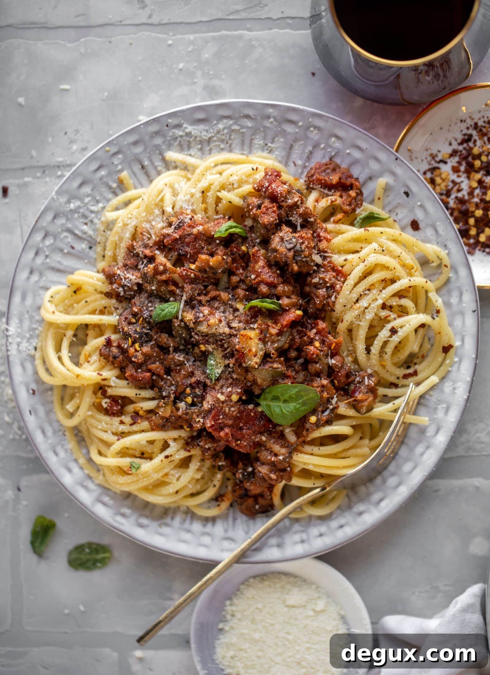 This lentil bolognese is incredible! Super hearty, loaded with vegetables, saucy, rich and decadent. You won't even miss the meat!