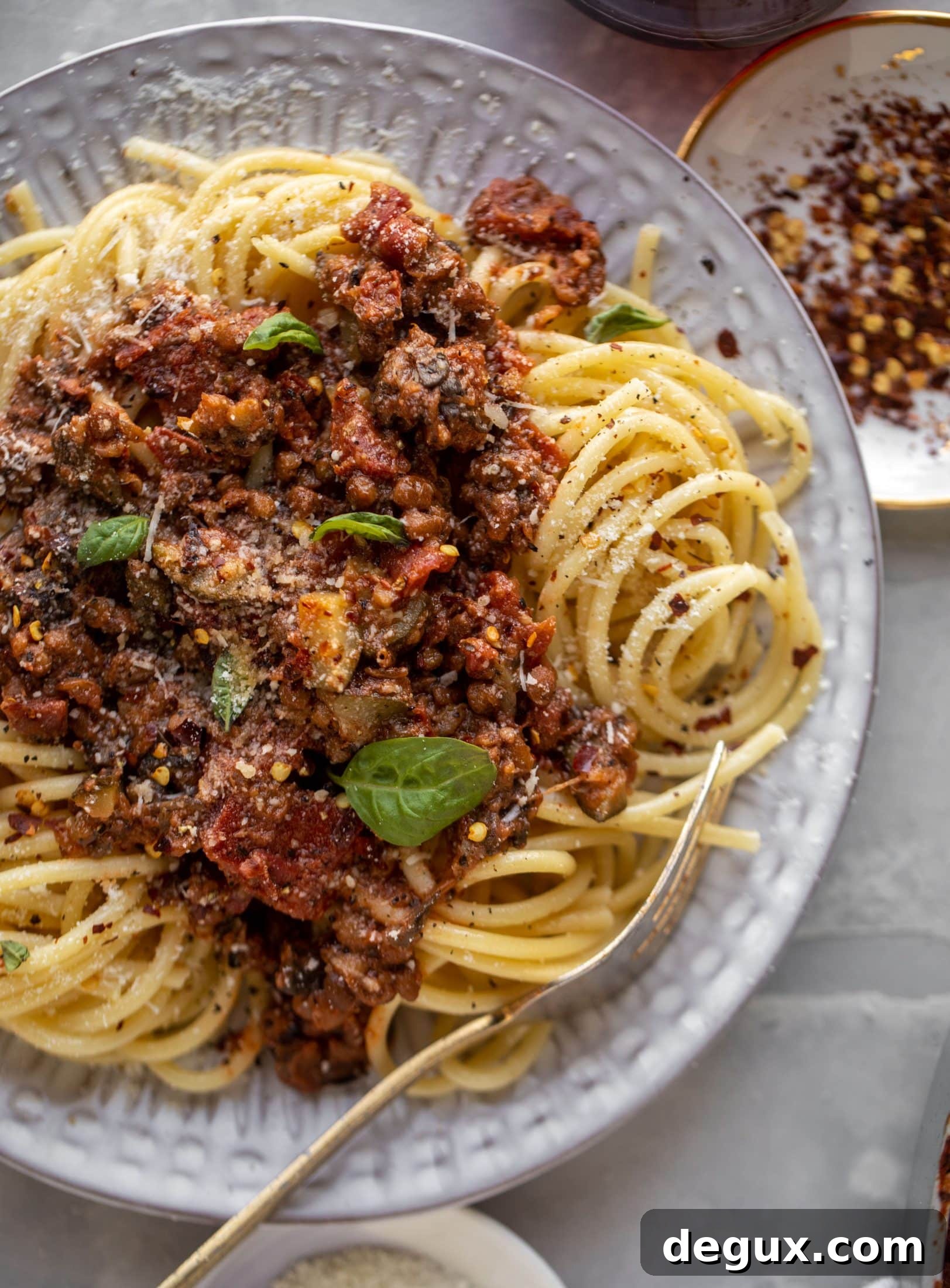 up close lentil bolognese with a fork