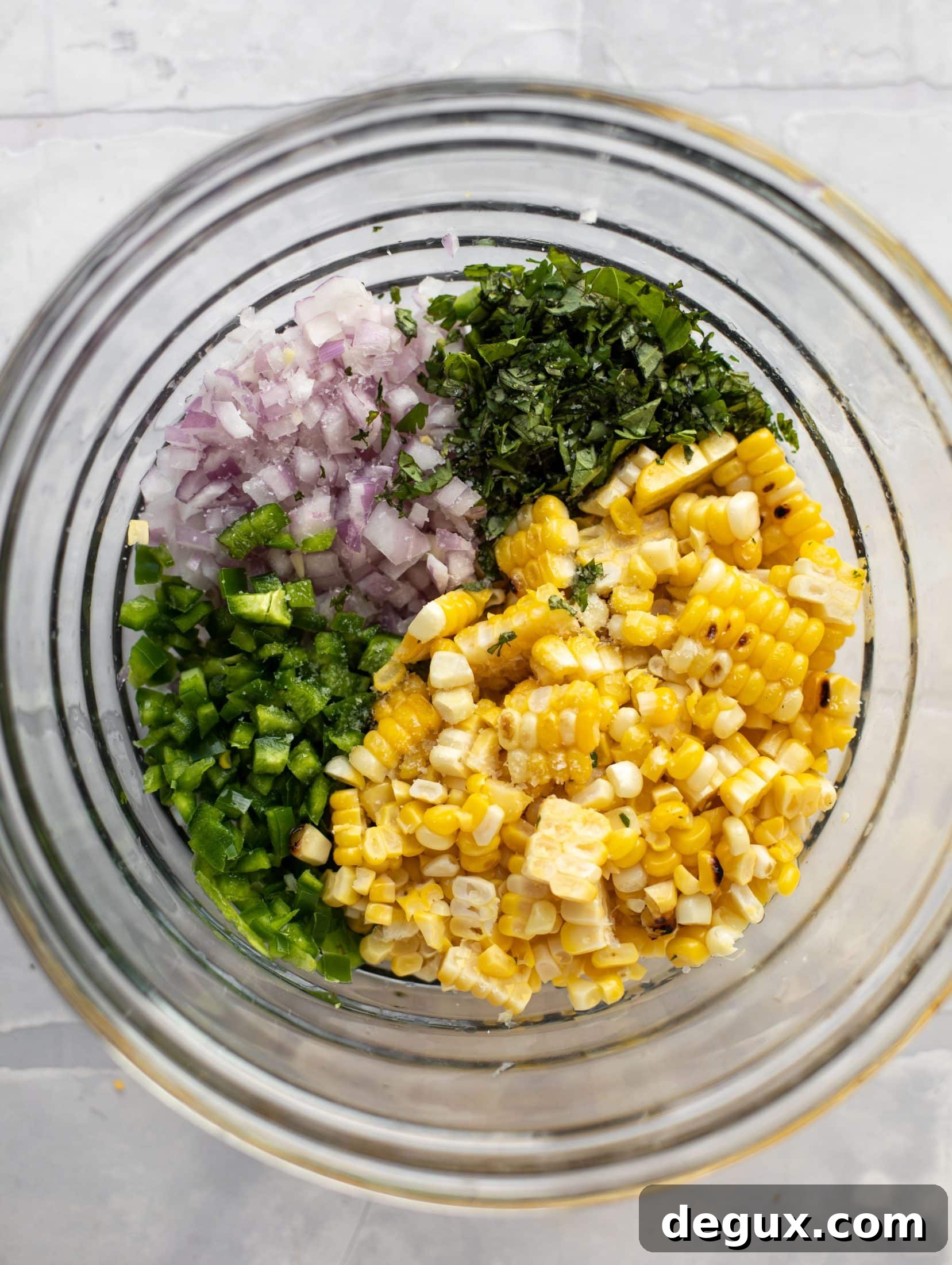Coffee-Rubbed Strip Steak with Herbed Corn Salsa 8 corn, jalapeno, onion, cilantro and basil in a bowl