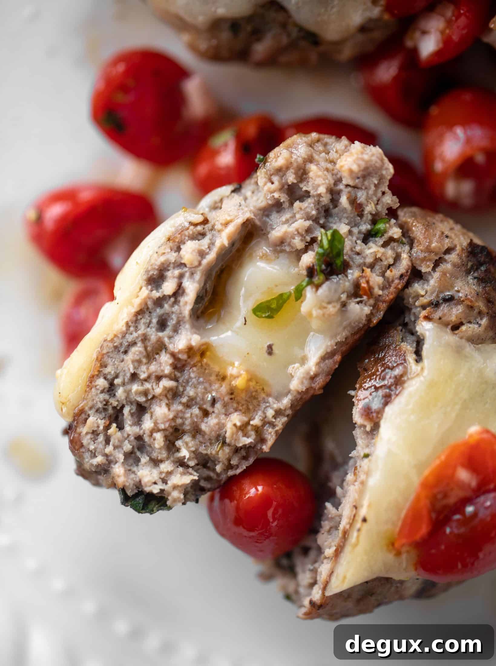 inside of bruschetta chicken burger stuffed with cheese