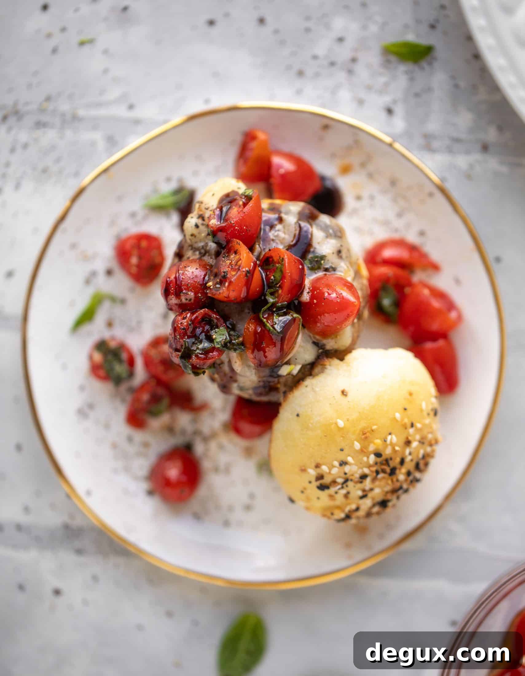 open faced bruschetta chicken burger on a plate
