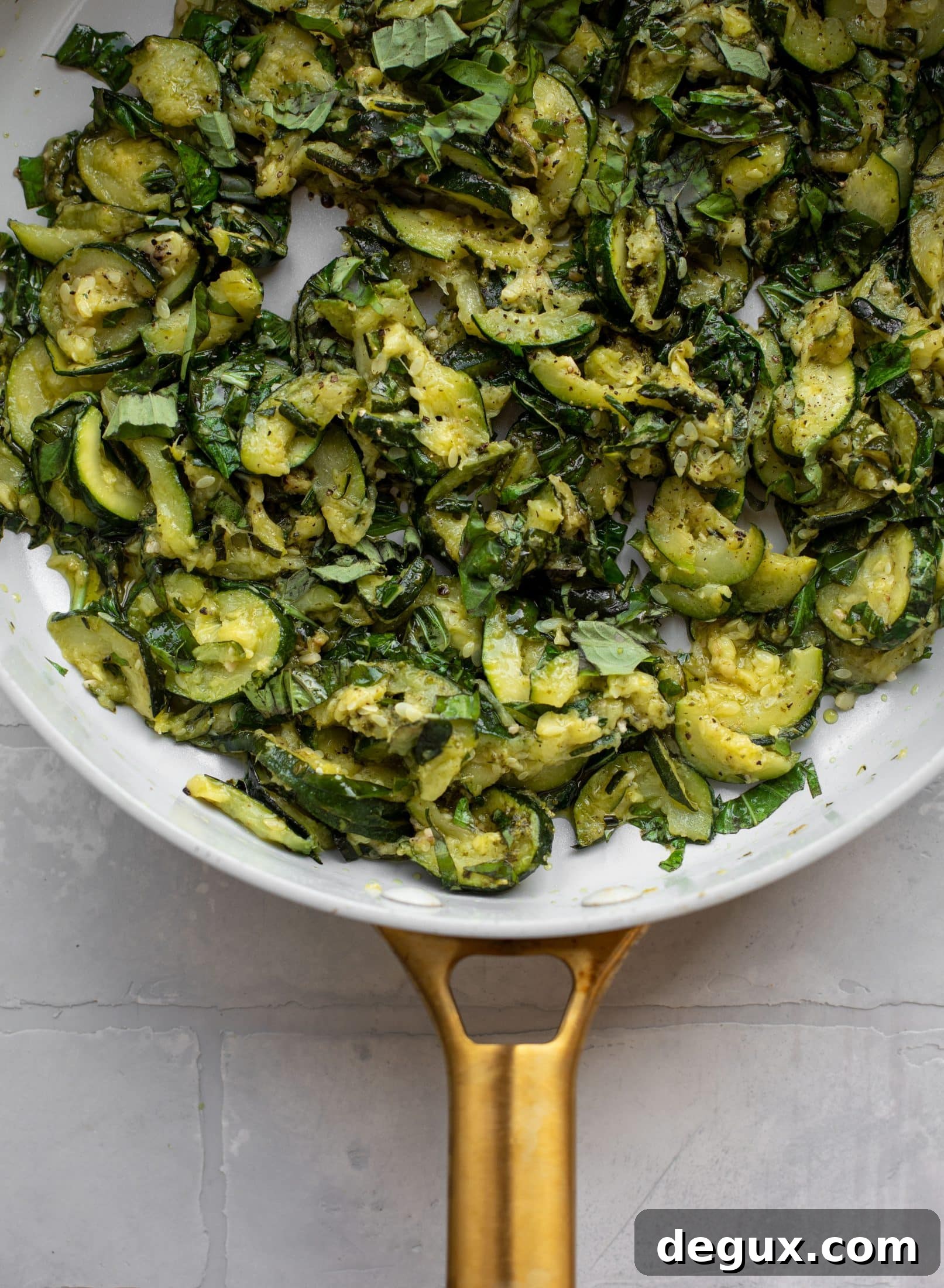 zucchini and fresh basil in skillet