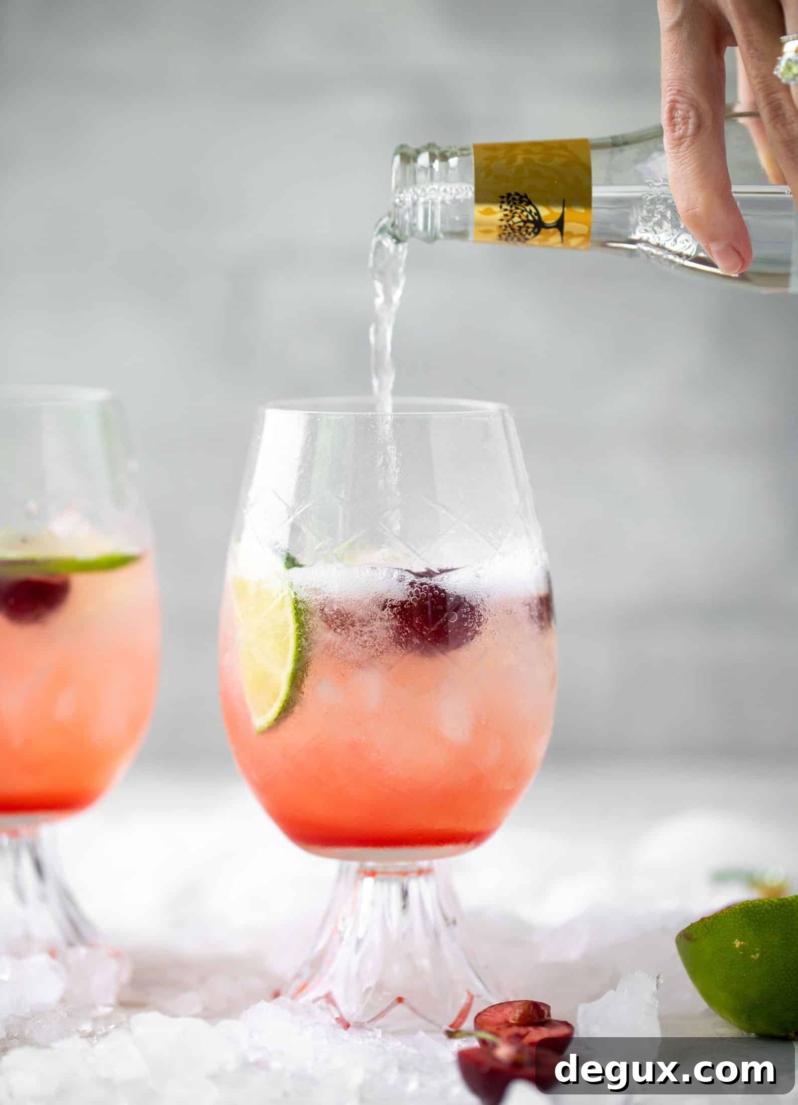 Cherry Lime Gin & Tonic Cocktail Recipe: Refreshing Summer Drink 6 pouring tonic into cherry lime gin and tonic
