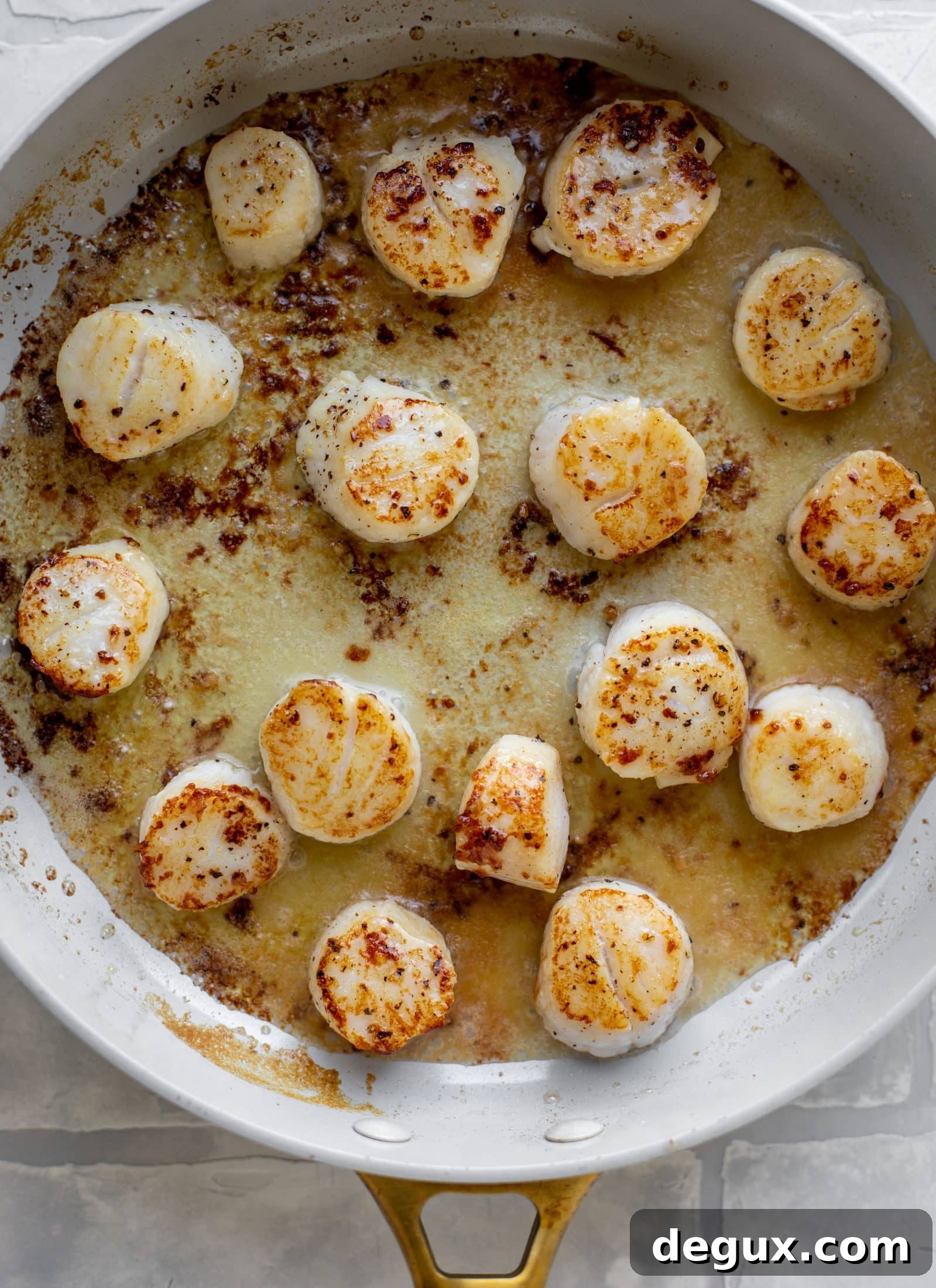 seared garlic butter scallops in skillet