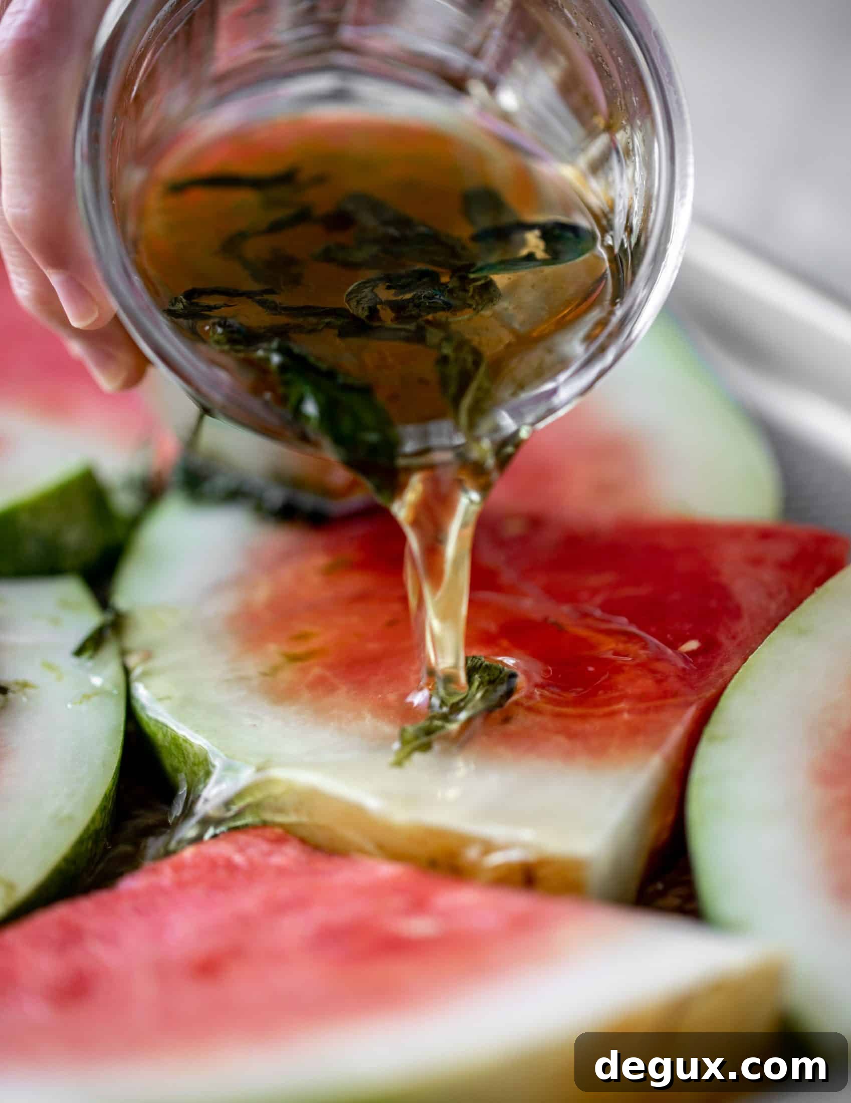 pouring mojito syrup on watermelon