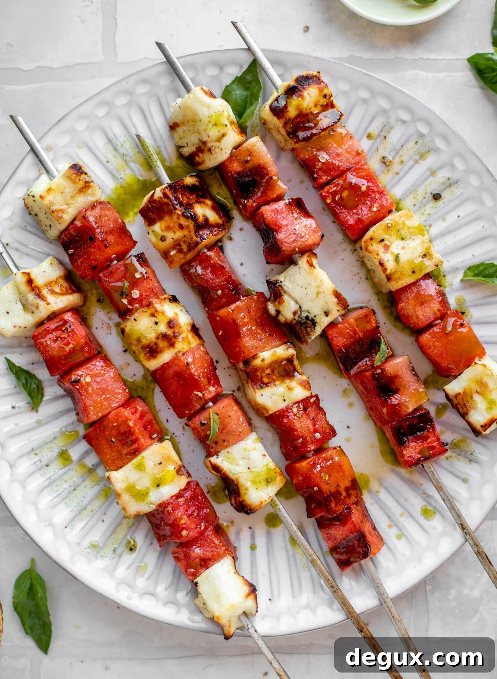 grilled watermelon halloumi skewers with mint basil oil