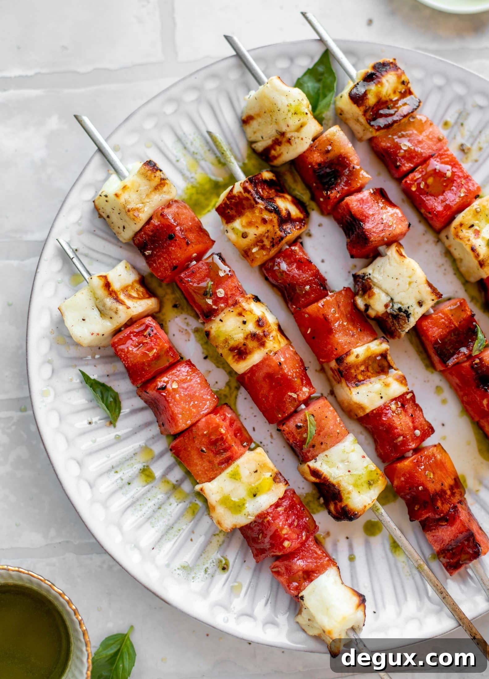 grilled watermelon halloumi skewers with mint basil oil