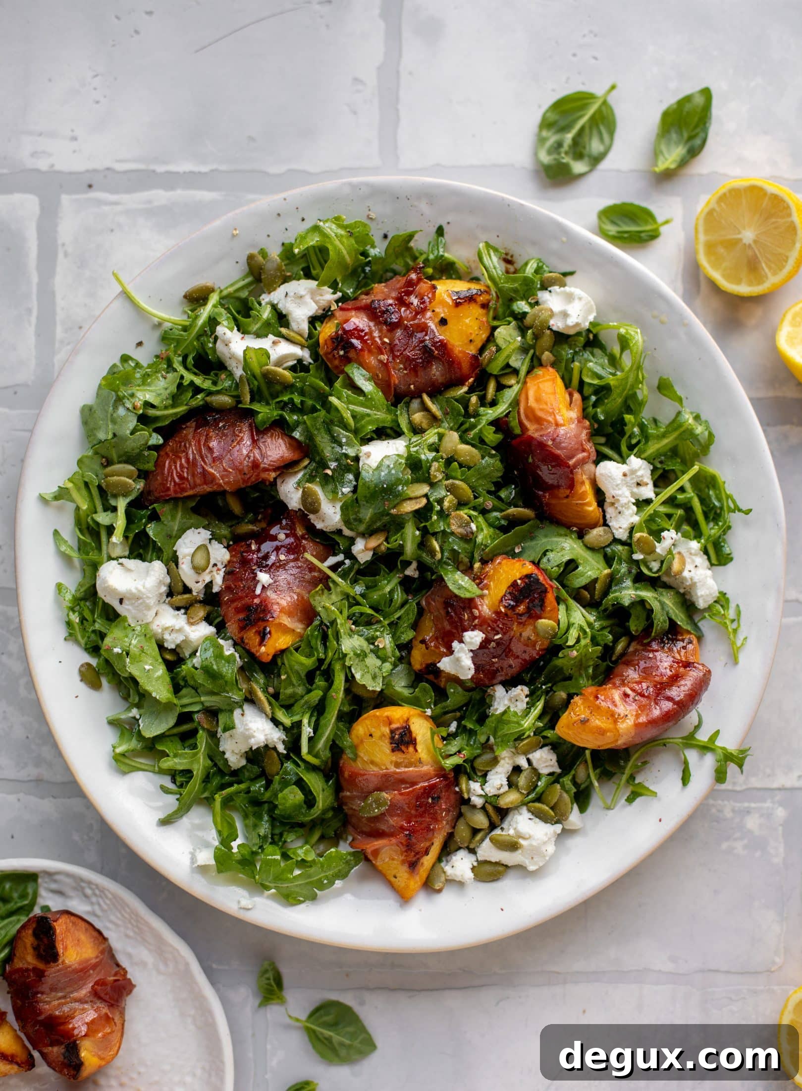 Grilled Prosciutto-Wrapped Peaches with Arugula and Goat Cheese 7 grilled prosciutto wrapped peaches with arugula and goat cheese