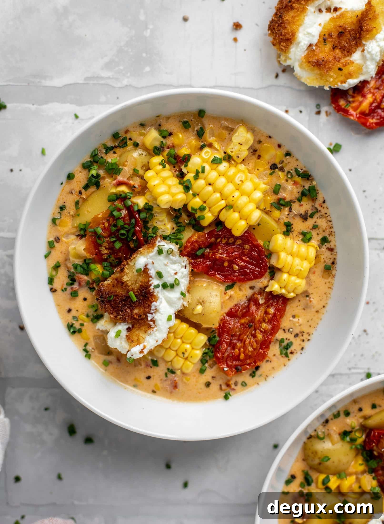 sun dried tomato corn chowder with crispy goat cheese