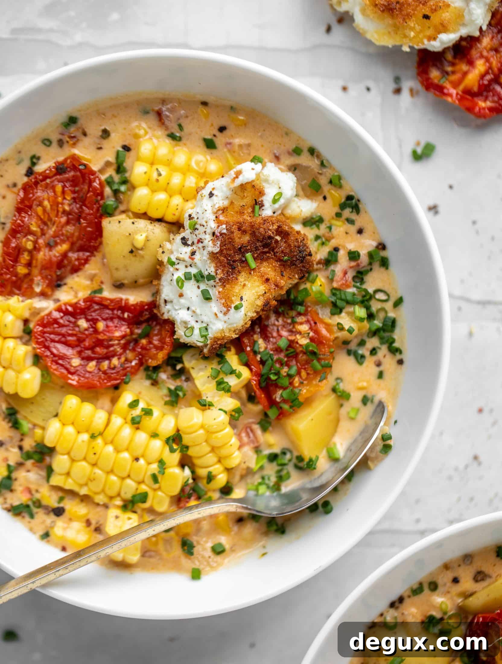 sun dried tomato corn chowder with crispy goat cheese