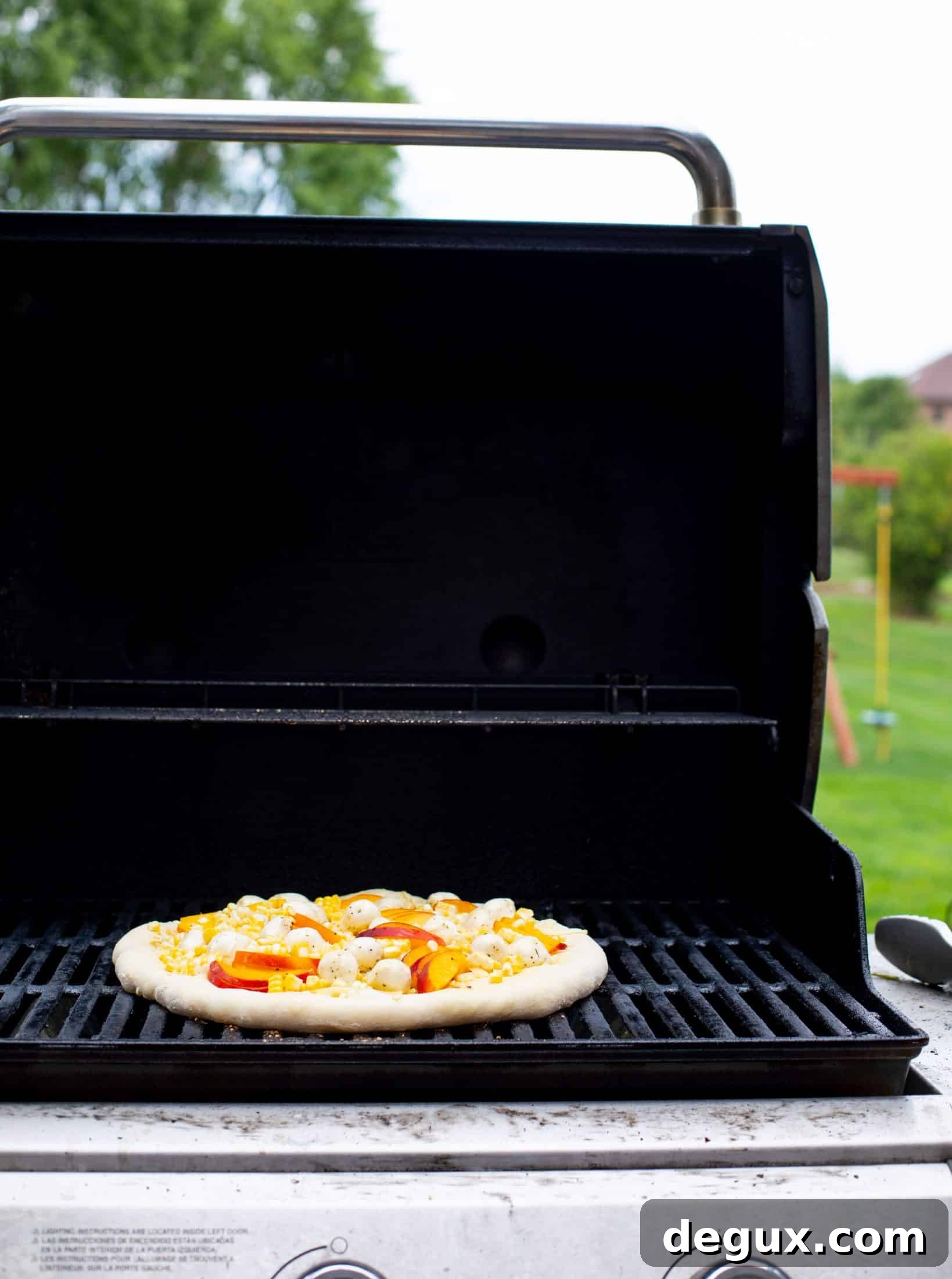 Grilled Peach and Corn Pizza with Chili Garlic Glaze 5 corn peach pizza on the grill