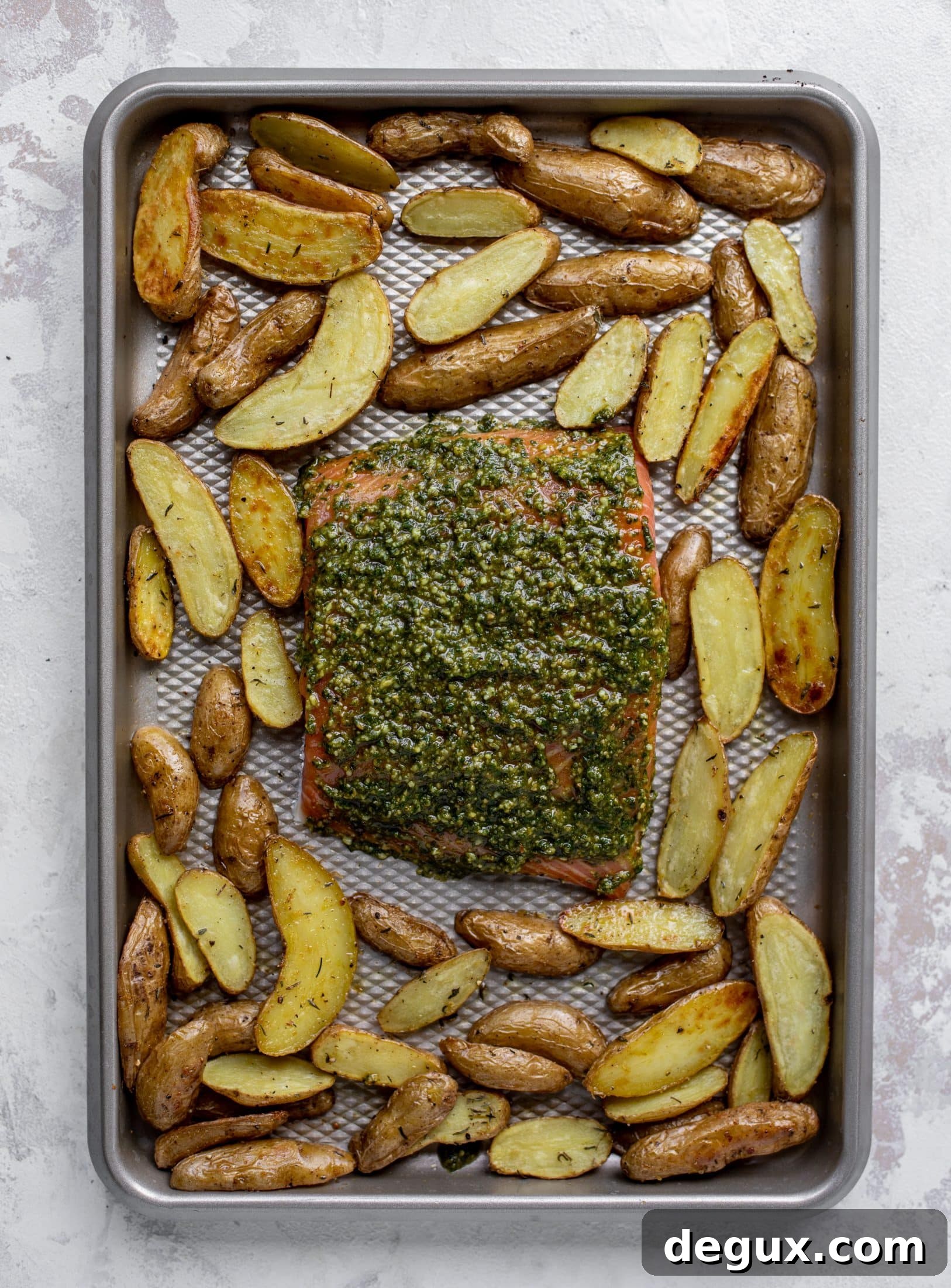 sheet pan pesto salmon ready for the oven