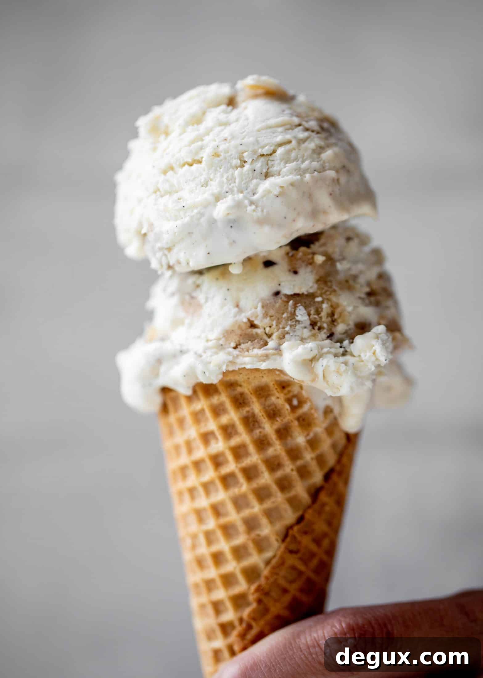 Salted Chocolate Chip Cookie Dough No-Churn Ice Cream 7 scoop of no churn salted chocolate chip cookie dough ice cream on a sugar cone