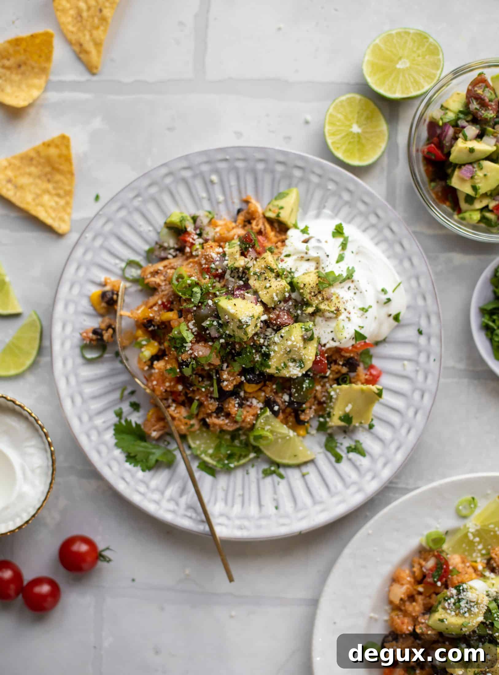 one pot salsa chicken quinoa topped with avocado pico de gallo