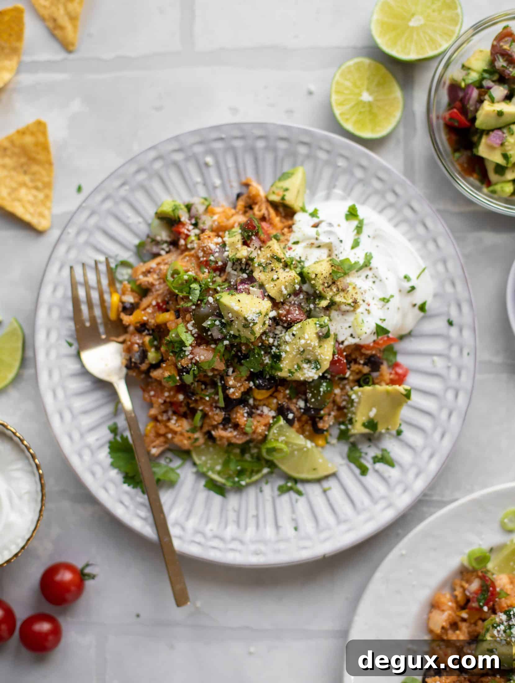 one pot salsa chicken quinoa topped with avocado pico de gallo