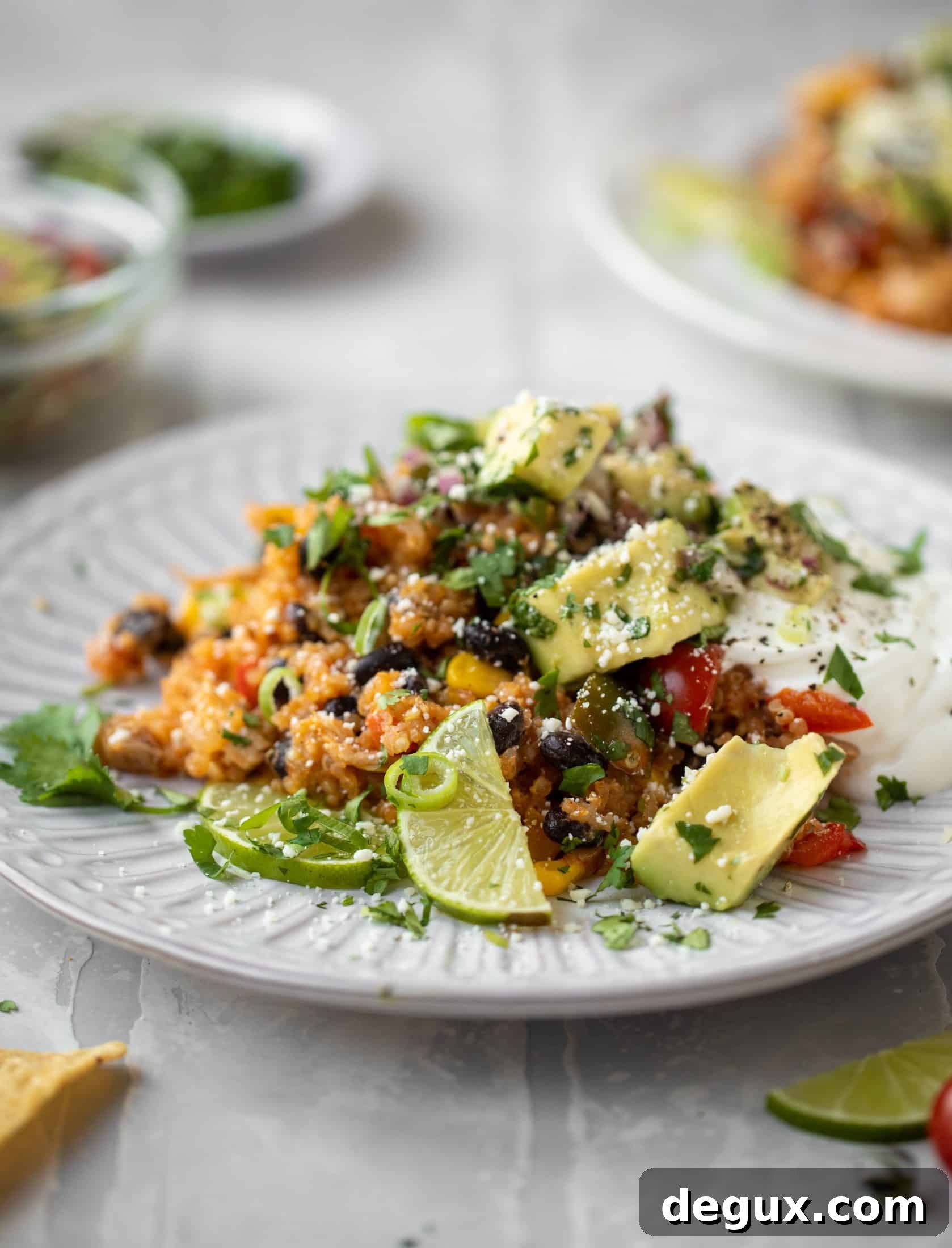 one pot salsa chicken quinoa topped with avocado pico de gallo