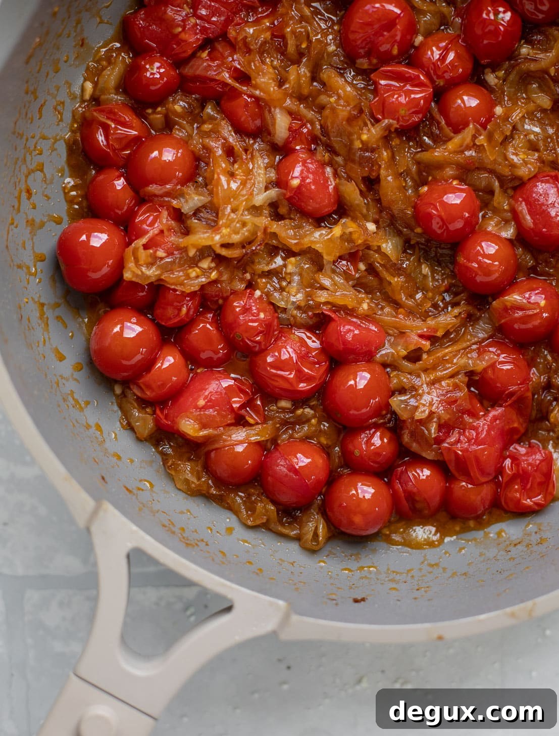 Caramelized Onion and Burst Tomato Pasta Skillet Recipe 5 caramelized onions and burst cherry tomatoes in a skillet