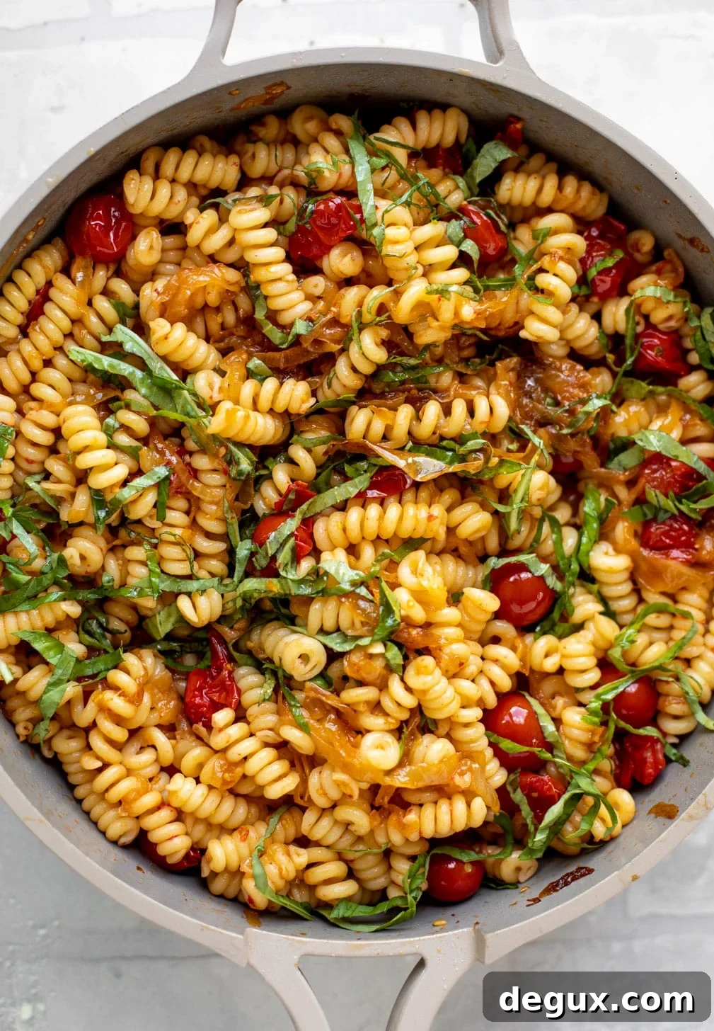 Caramelized Onion and Burst Tomato Pasta Skillet Recipe 6 caramelized onion tomato pasta with basil in a skillet