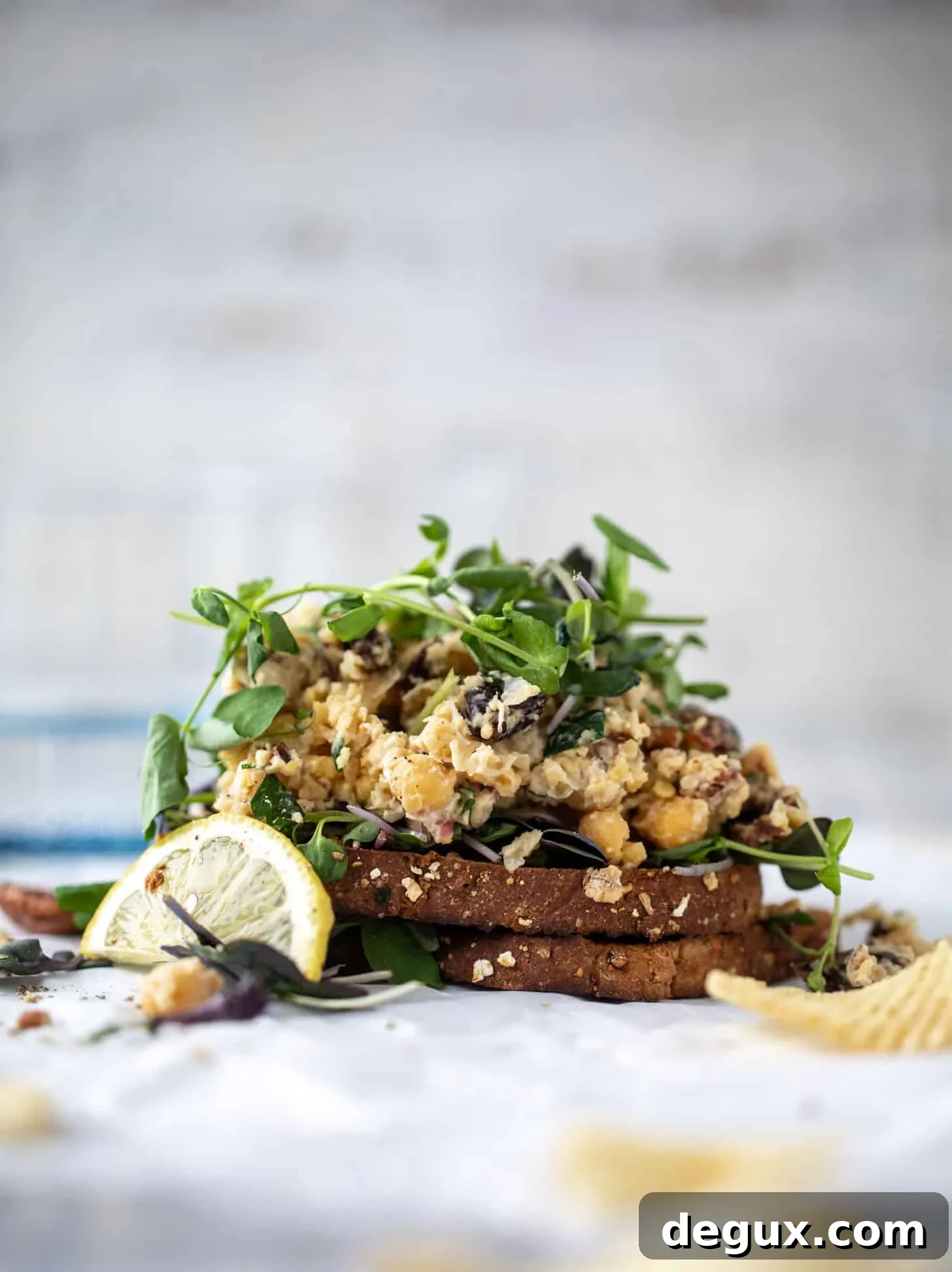 20-Minute Smashed Chickpea Salad for a Quick Flavorful Lunch 2 smashed chickpea salad on toast with micro greens