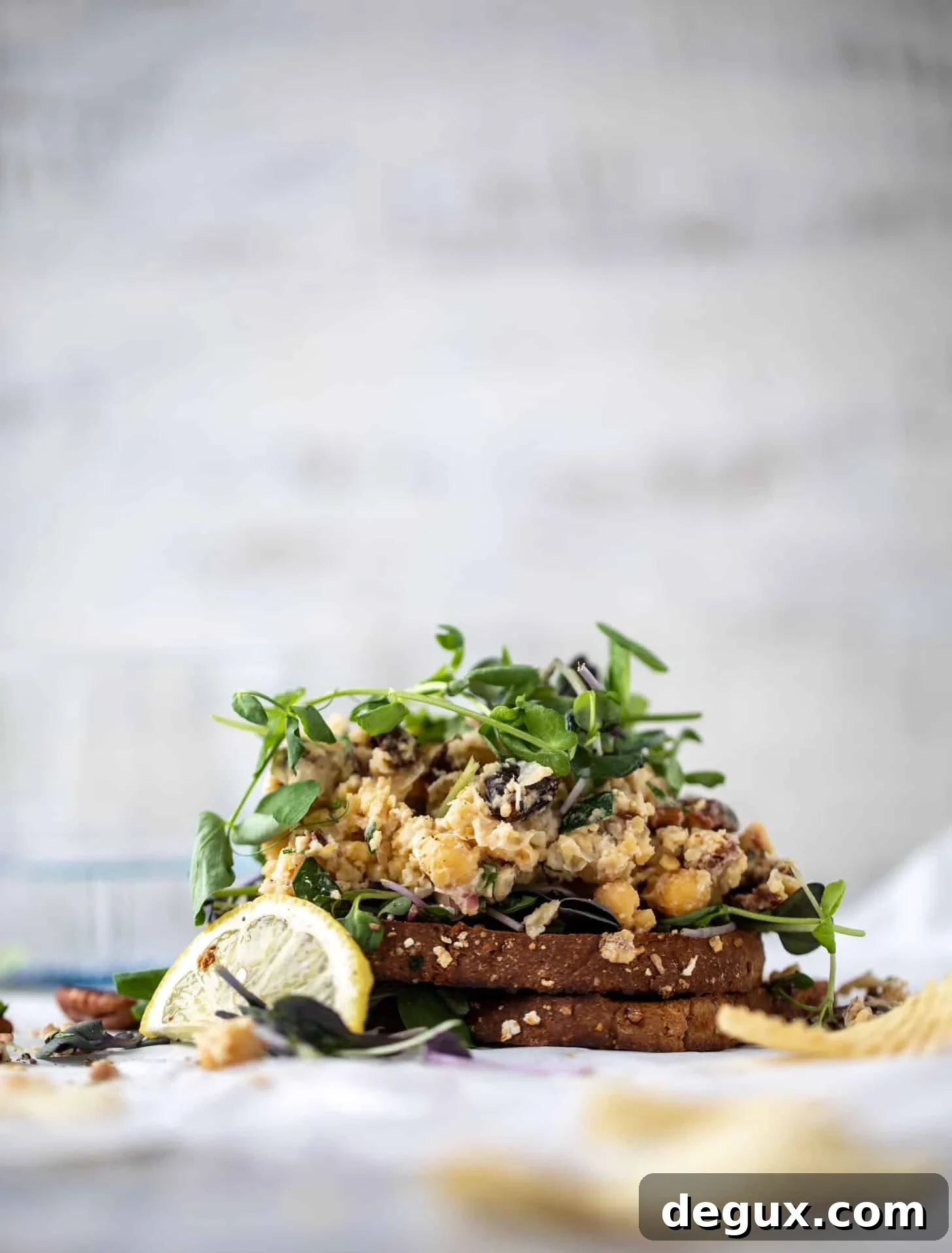 20-Minute Smashed Chickpea Salad for a Quick Flavorful Lunch 6 smashed chickpea salad on toast with micro greens